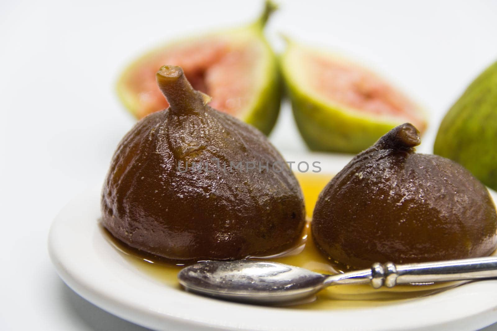Figs in syrup . Dessert that is accompanied with fresh cheese and walnuts by GabrielaBertolini