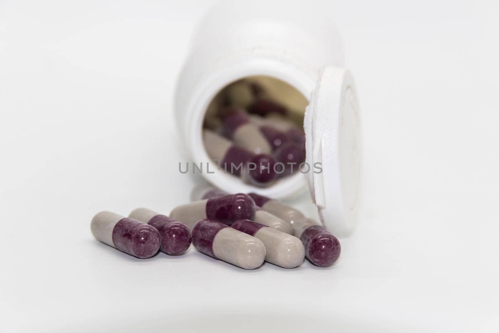 Detail of a bottle of capsules with medical drugs.Concept Medicine, health by GabrielaBertolini