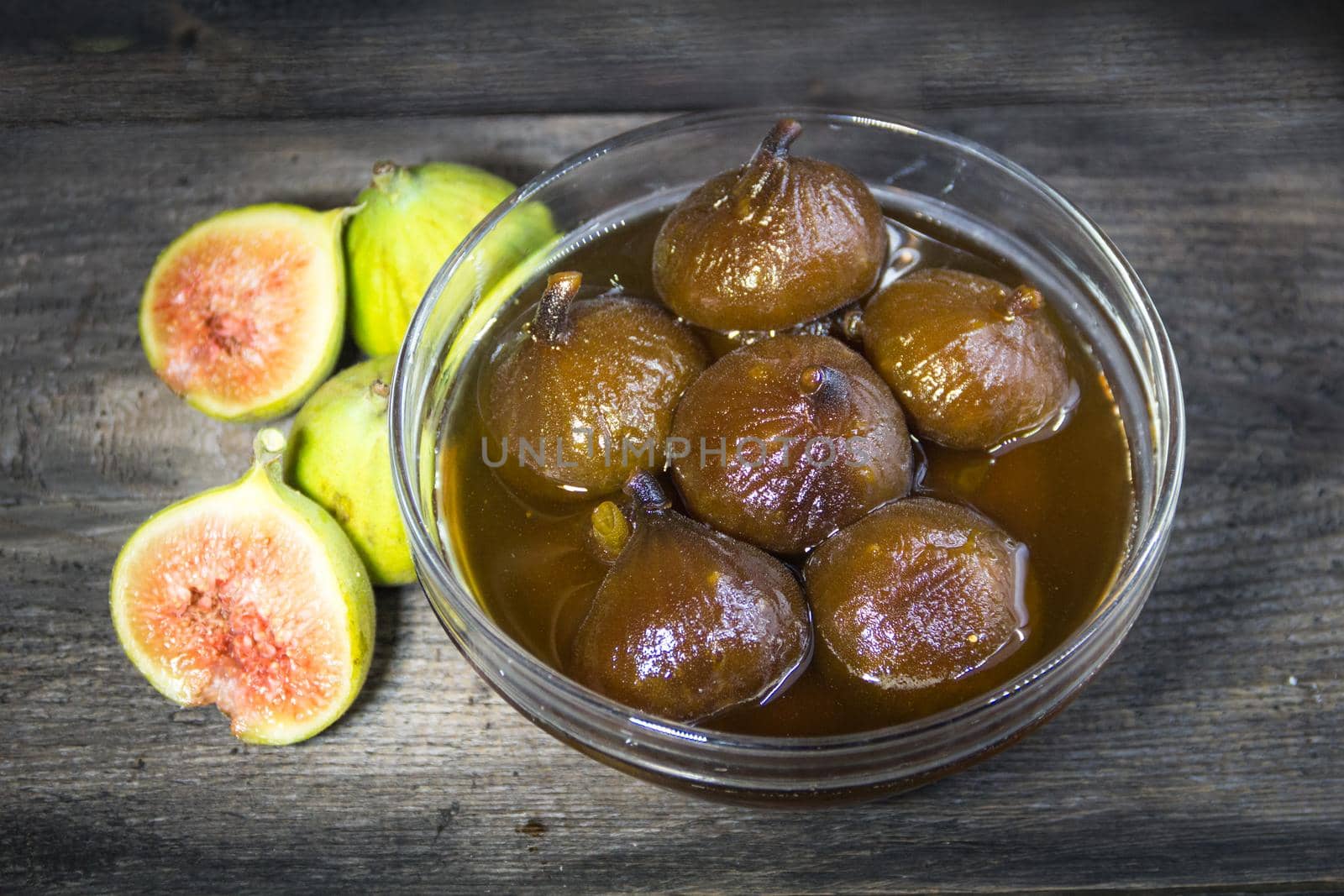 Figs in syrup . Dessert that is accompanied with fresh cheese and walnuts by GabrielaBertolini