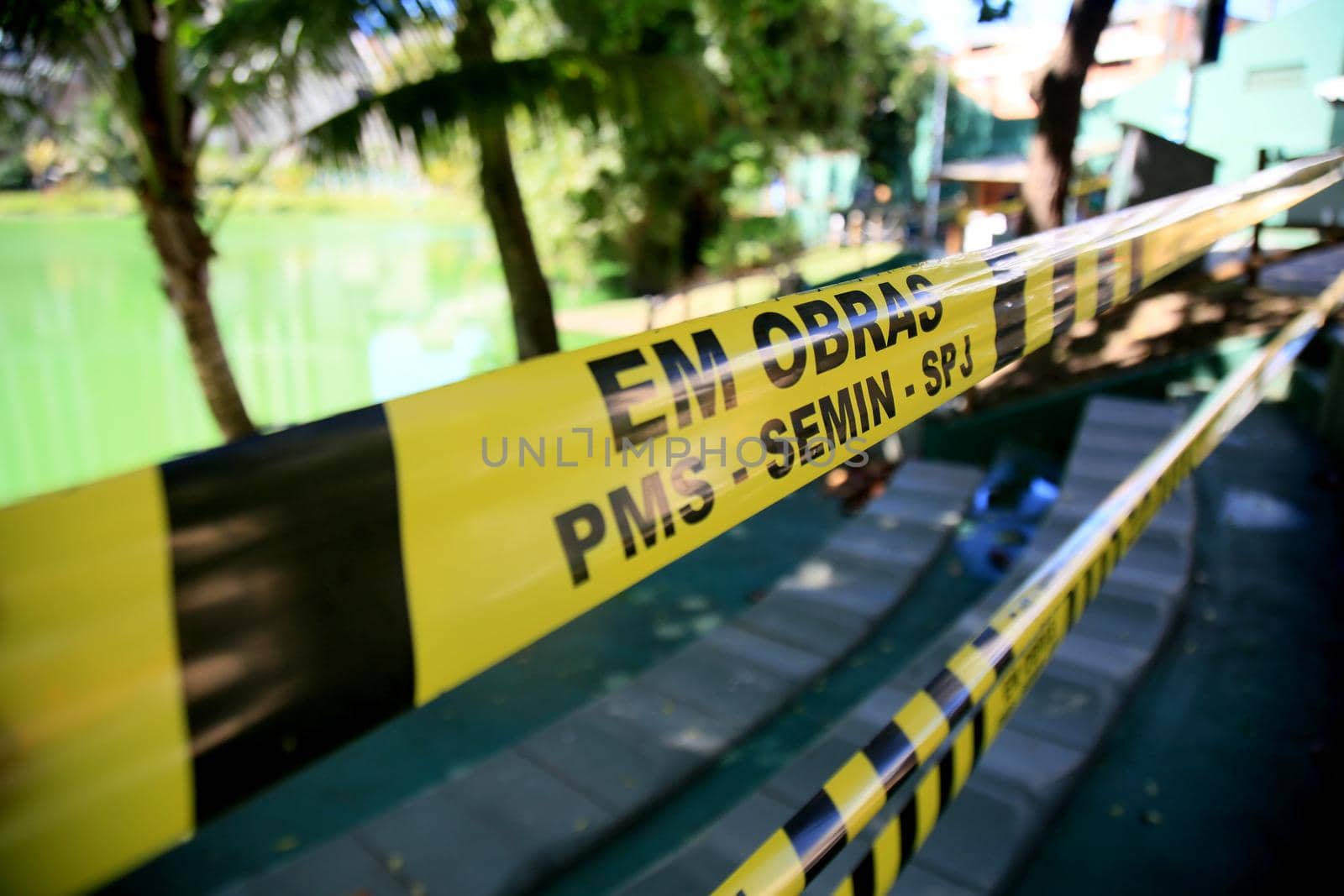 salvador, bahia, brazil - july 20, 2021: striped protective tape to isolate an area to prevent crowding of people in a park in the city of Salvador.
