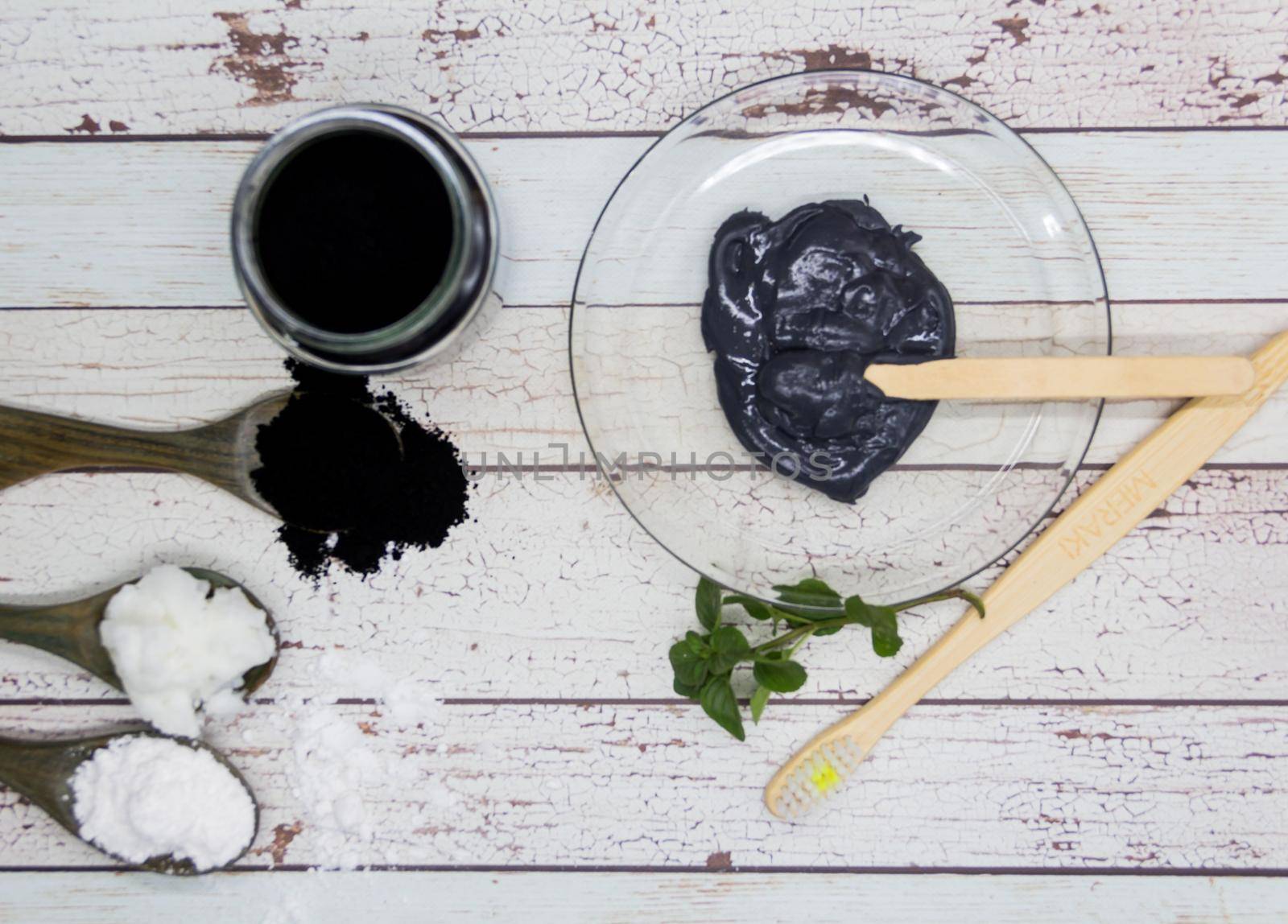 Ingredients for making activated charcoal toothpaste by GabrielaBertolini