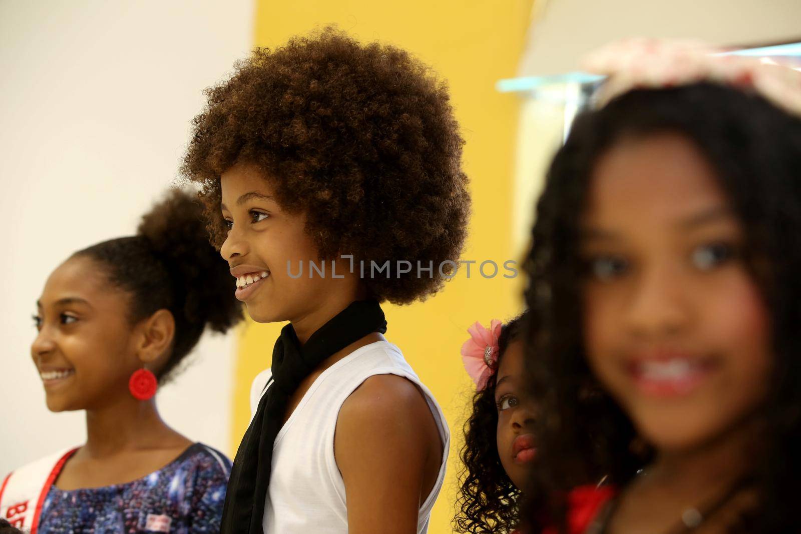 salvador, bahia, brazil - october 13, 2017: Children of black ethnicity are seen in a beauty salon in the city of Salvador.