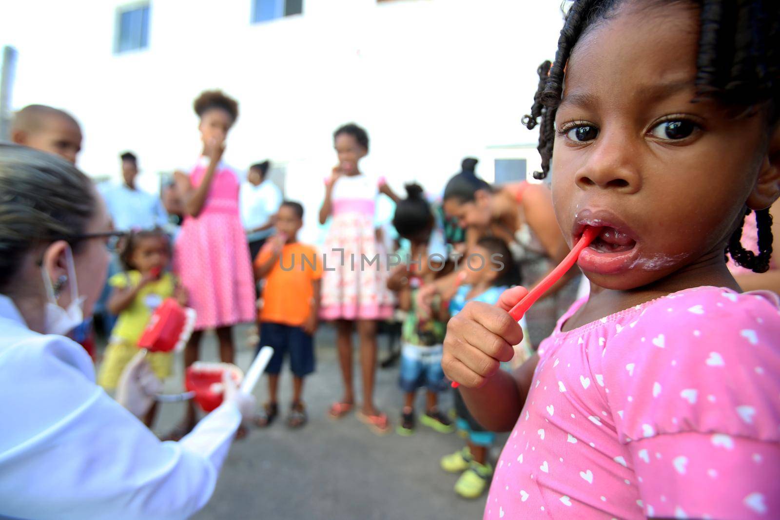 salvador, bahia, brazil - october 20, 2017:  dentita is tested in children's teething during social action in a daycare center in the city of Salvador.

