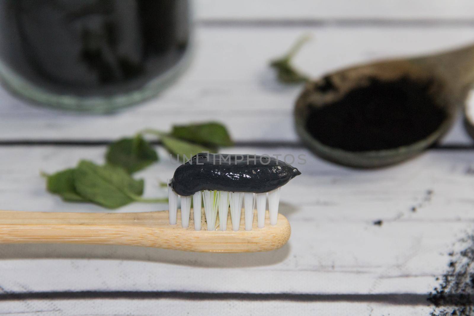Ingredients for making activated charcoal toothpaste by GabrielaBertolini