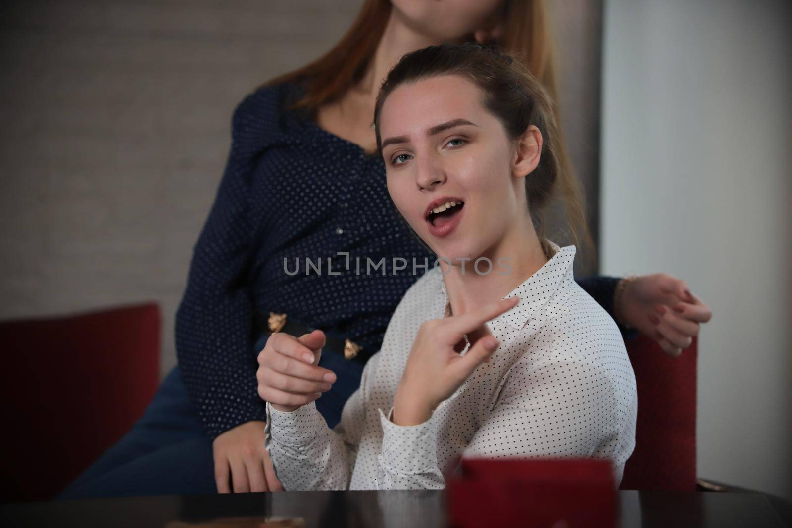 Portrait of young woman with funny face. Girl having fun. Close up