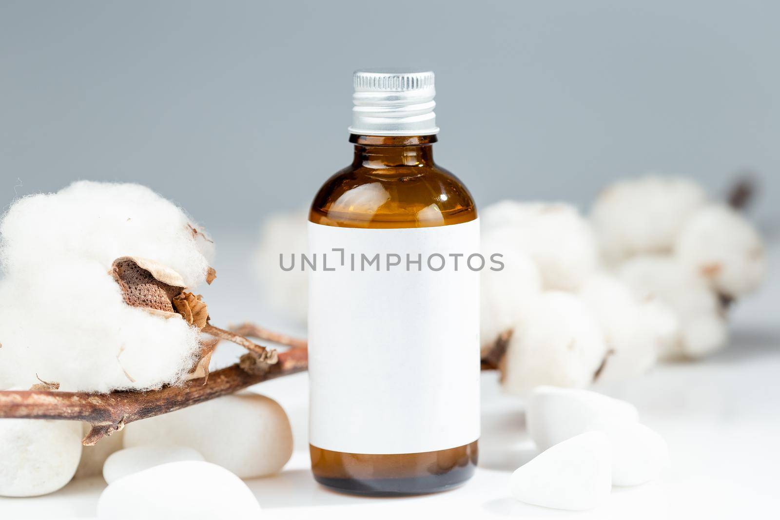 Brown glass bottle with metal cap for natural organic skin care product. White label mock up