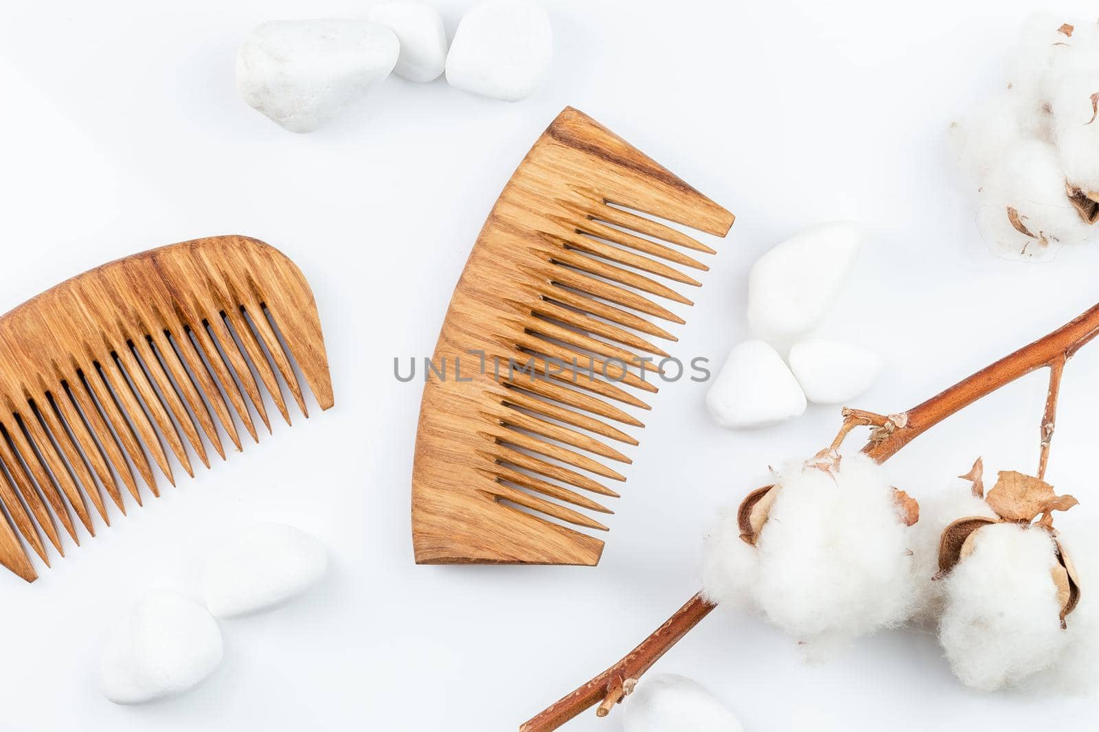 Wooden hair combs on a white background. Personal care, zero waste, sustainable lifestyle