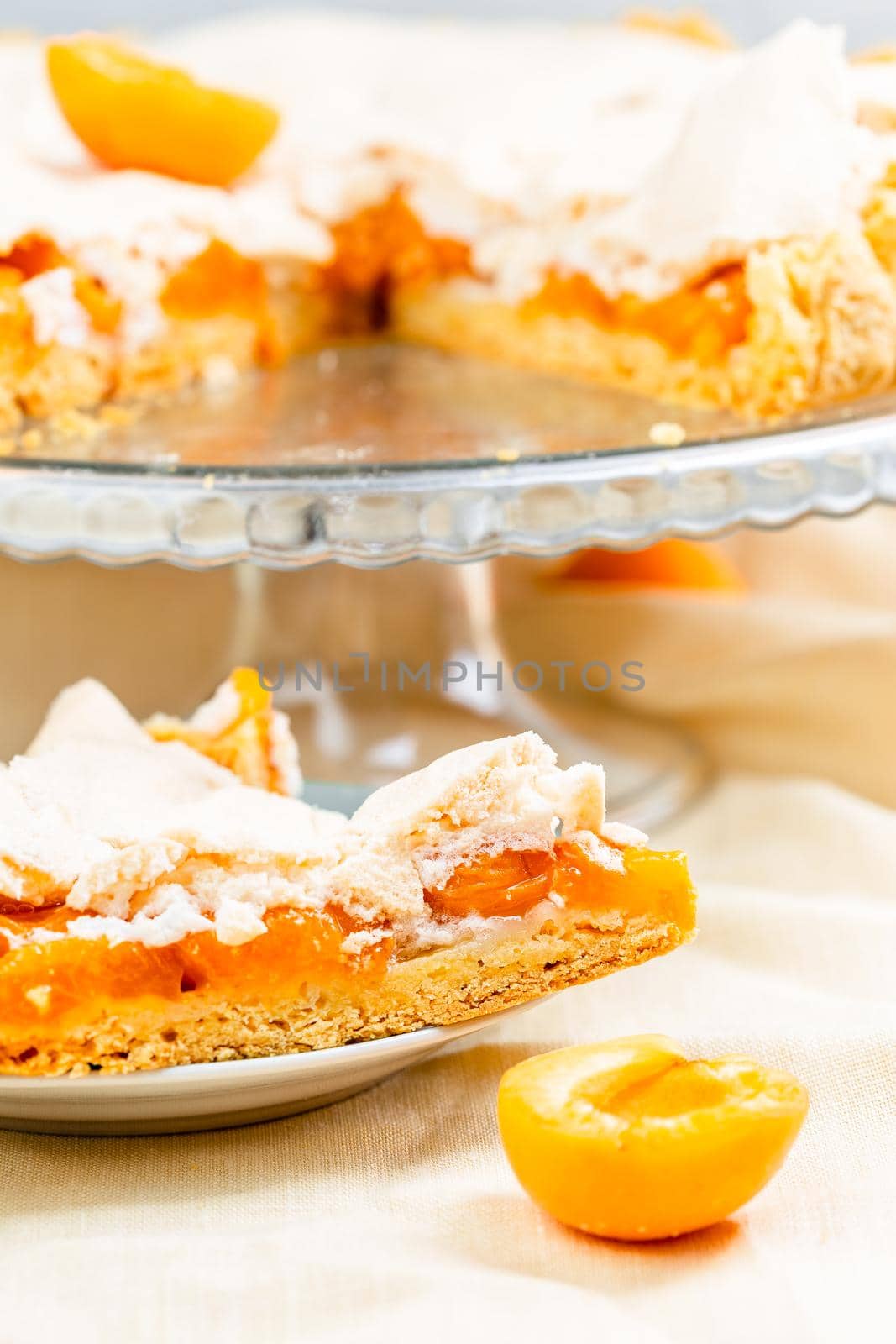 Slice of fresh baked apricot tart dessert glased top