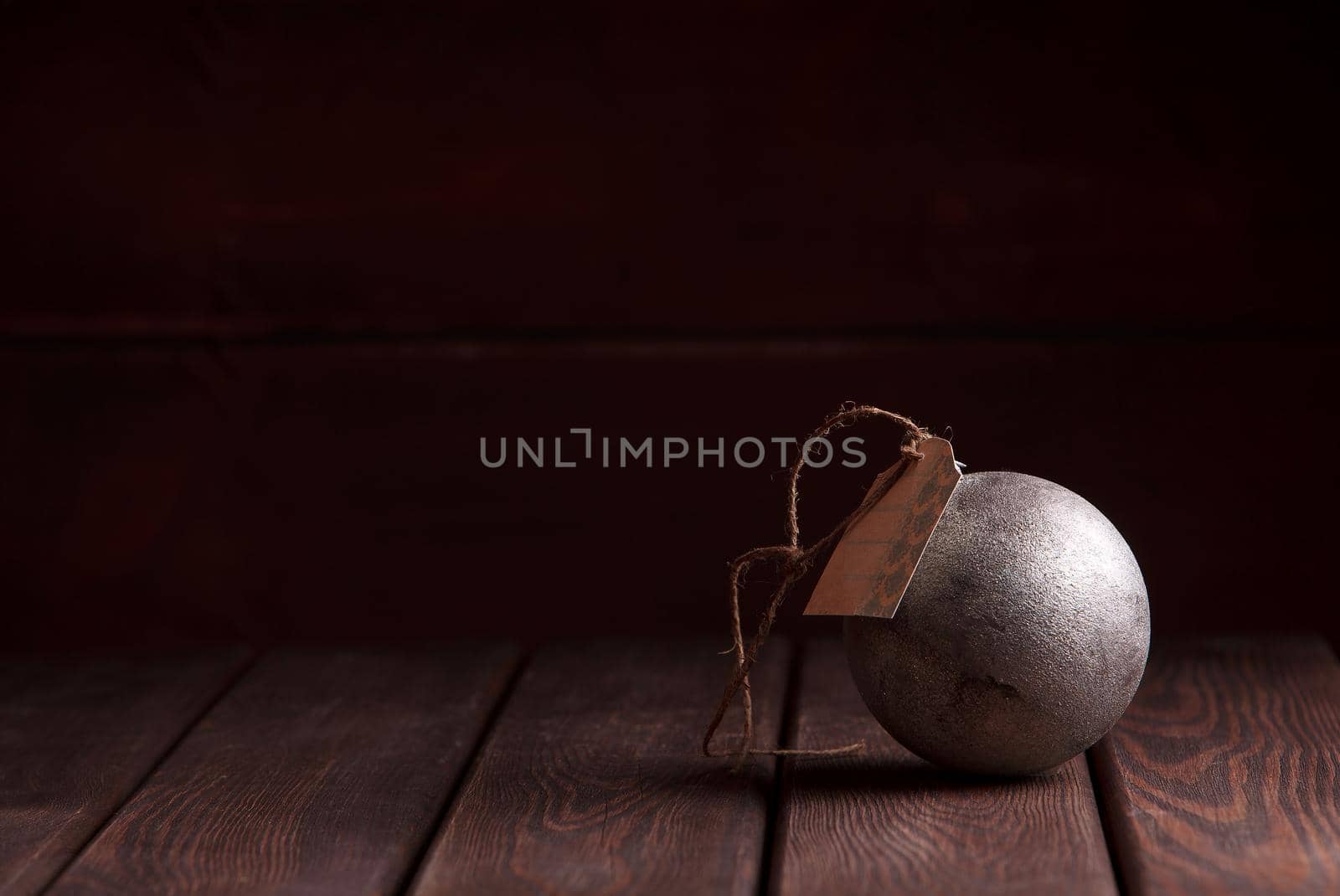 Christmas New Year decoration. Red vintage ball on wooden table dark wooden background by denisv86