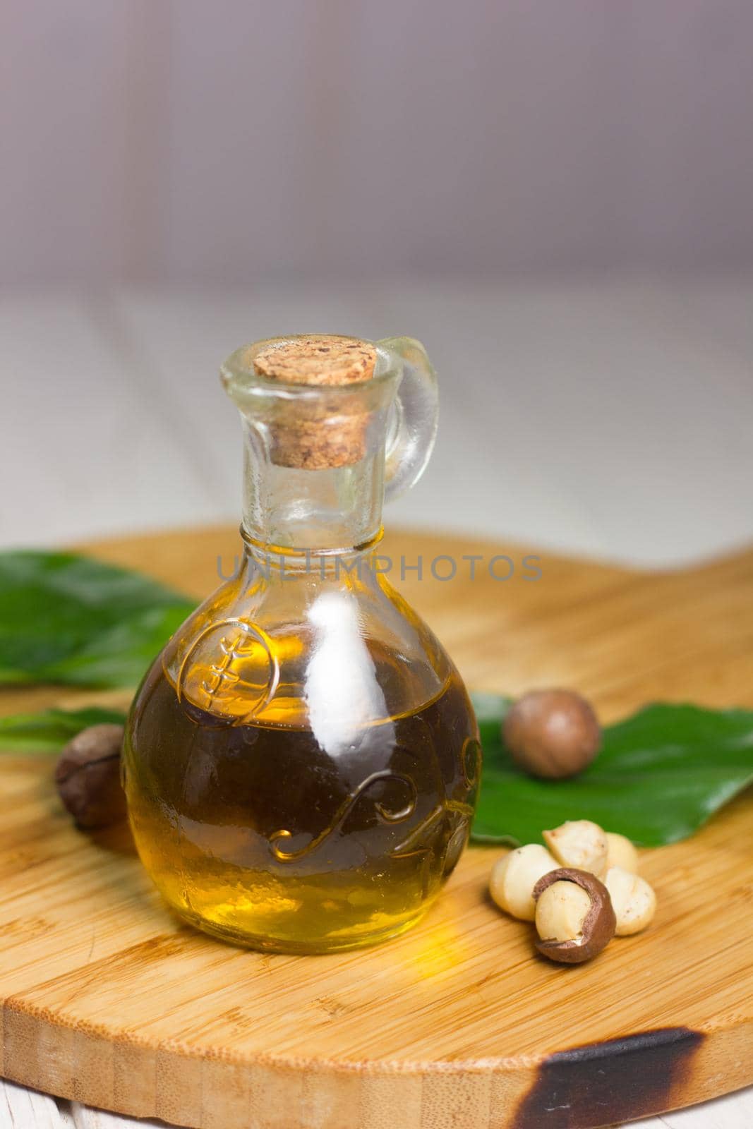 Macadamia oil in a glass bottle. Great photo for your needs.