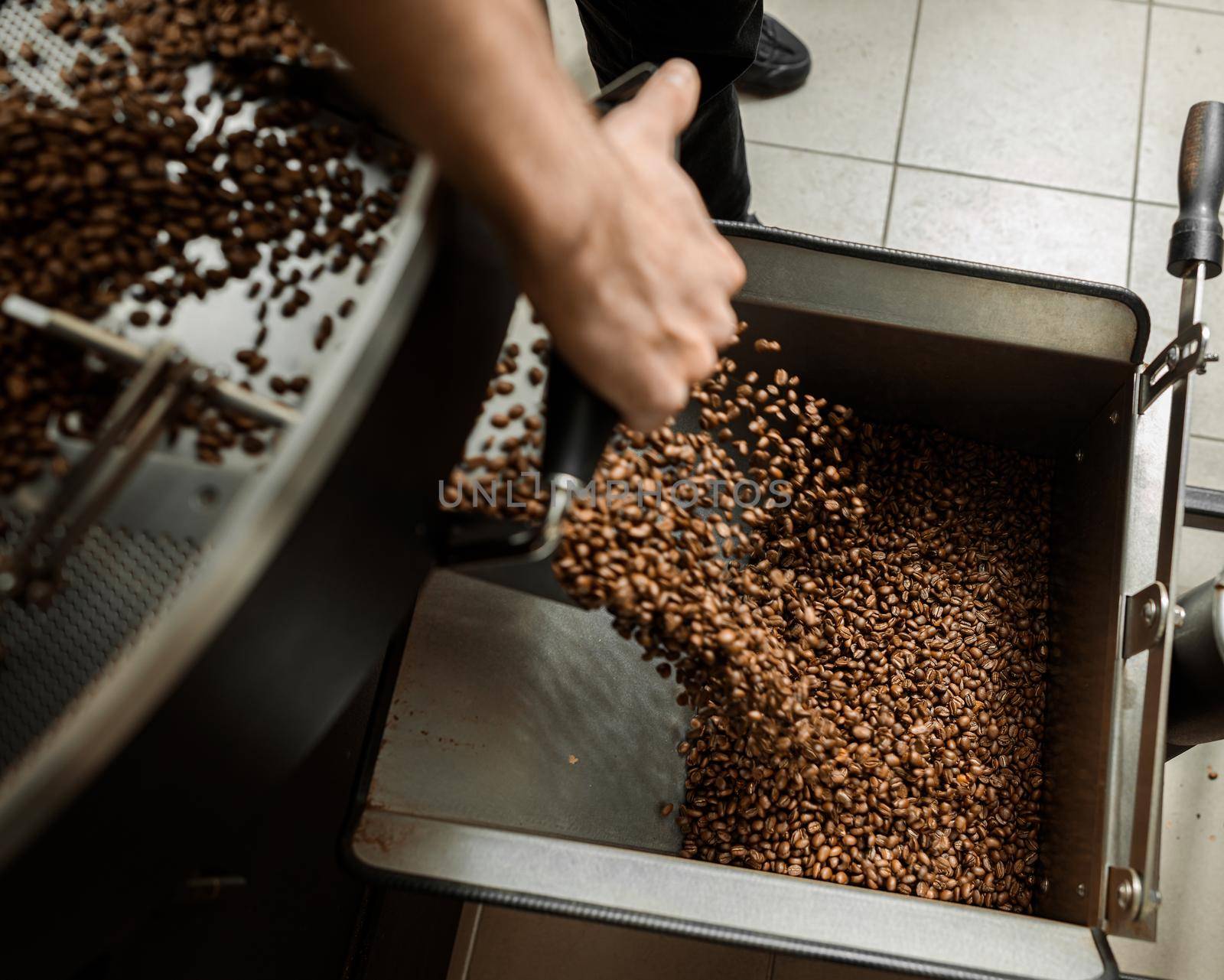 Coffee processing. Roastery, roasting machine and fresh beans by Yaroslav_astakhov