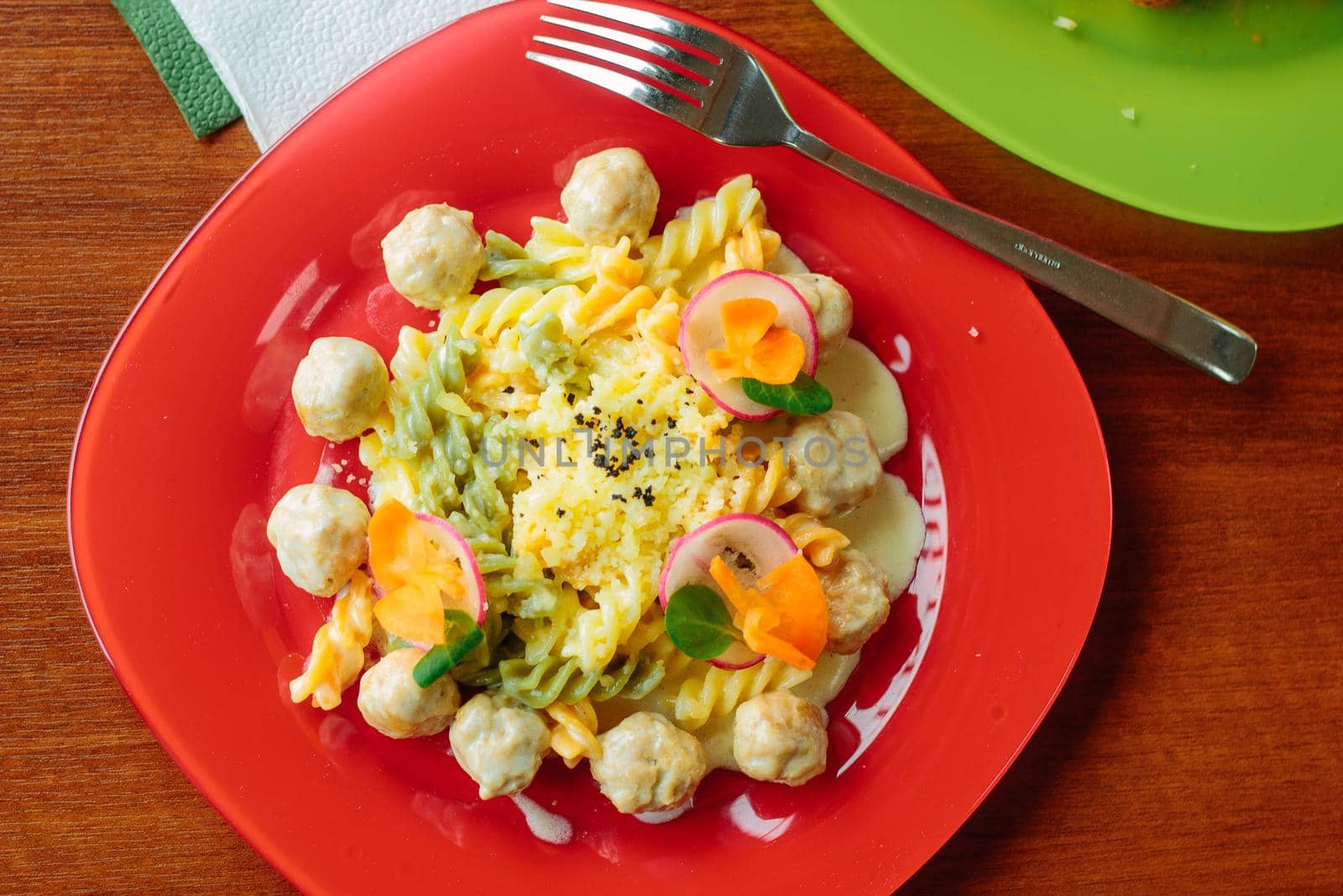 Fusilli pasta with meatballs and vegetables, great image for your needs.