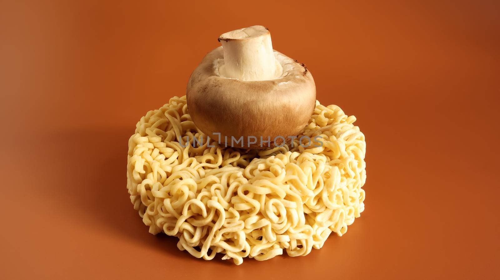 Asian instant noodles and mushrooms, traditional oriental food ramen and vegetables. fast food. The concept of vegetarianism. pasta, for the preparation of which it is enough to pour boiling water.