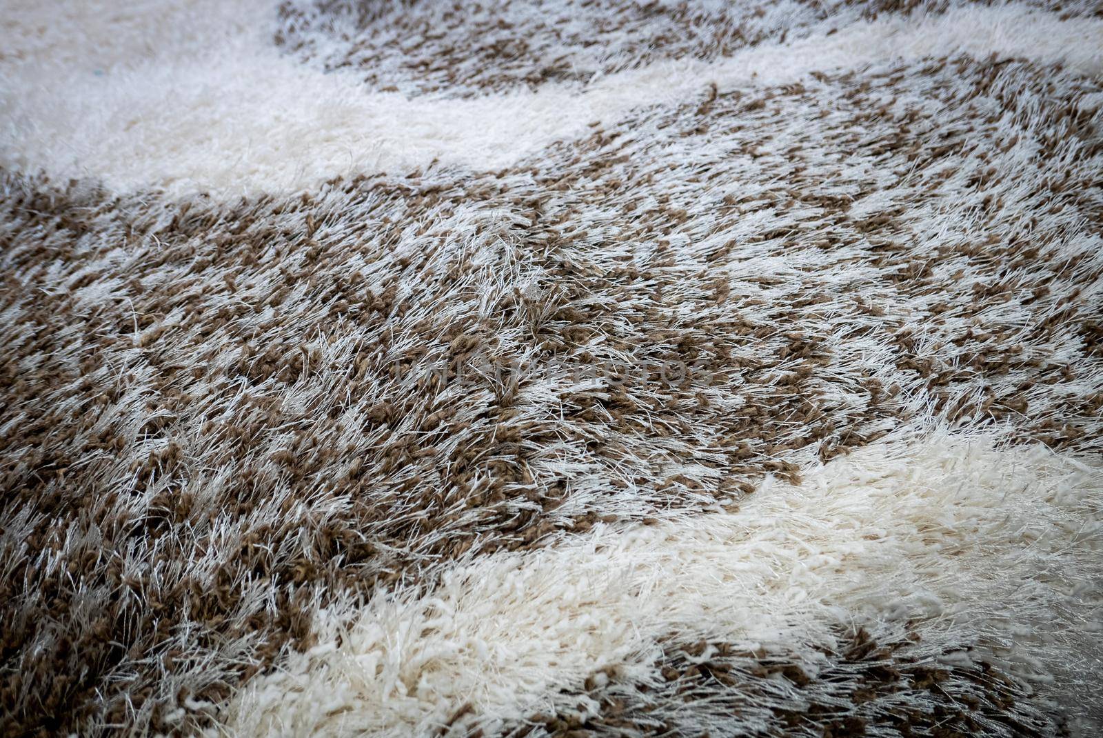 Close up view of carpet. Wall-to-wall carpeting background