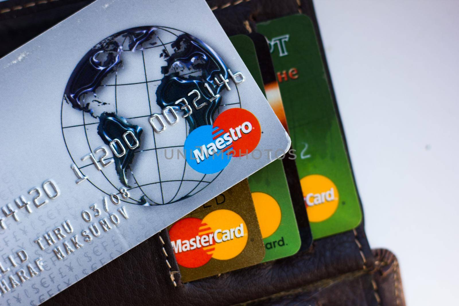 Ryazan, Russia - February 27, 2018: Credit card of Maestro brand over the leather wallet and number of cards