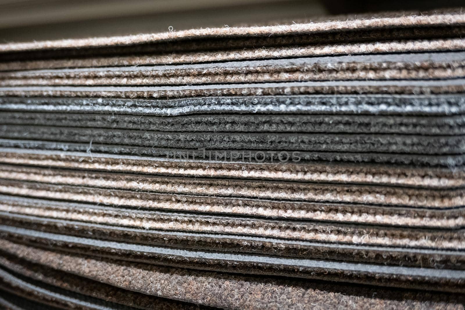 Pile of car mats in a fabric shop.