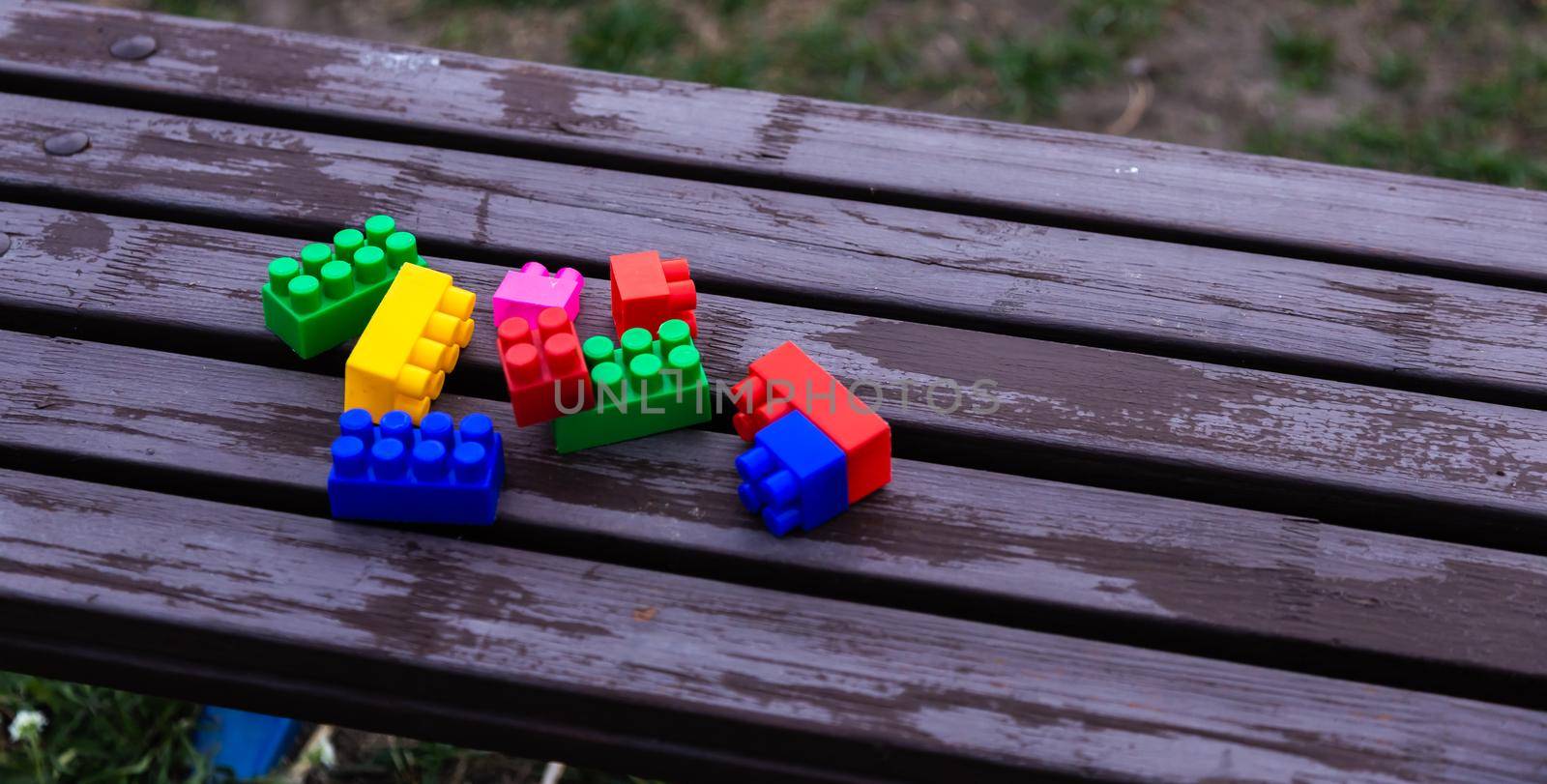 Colorful toy building blocks or bricks On wood background