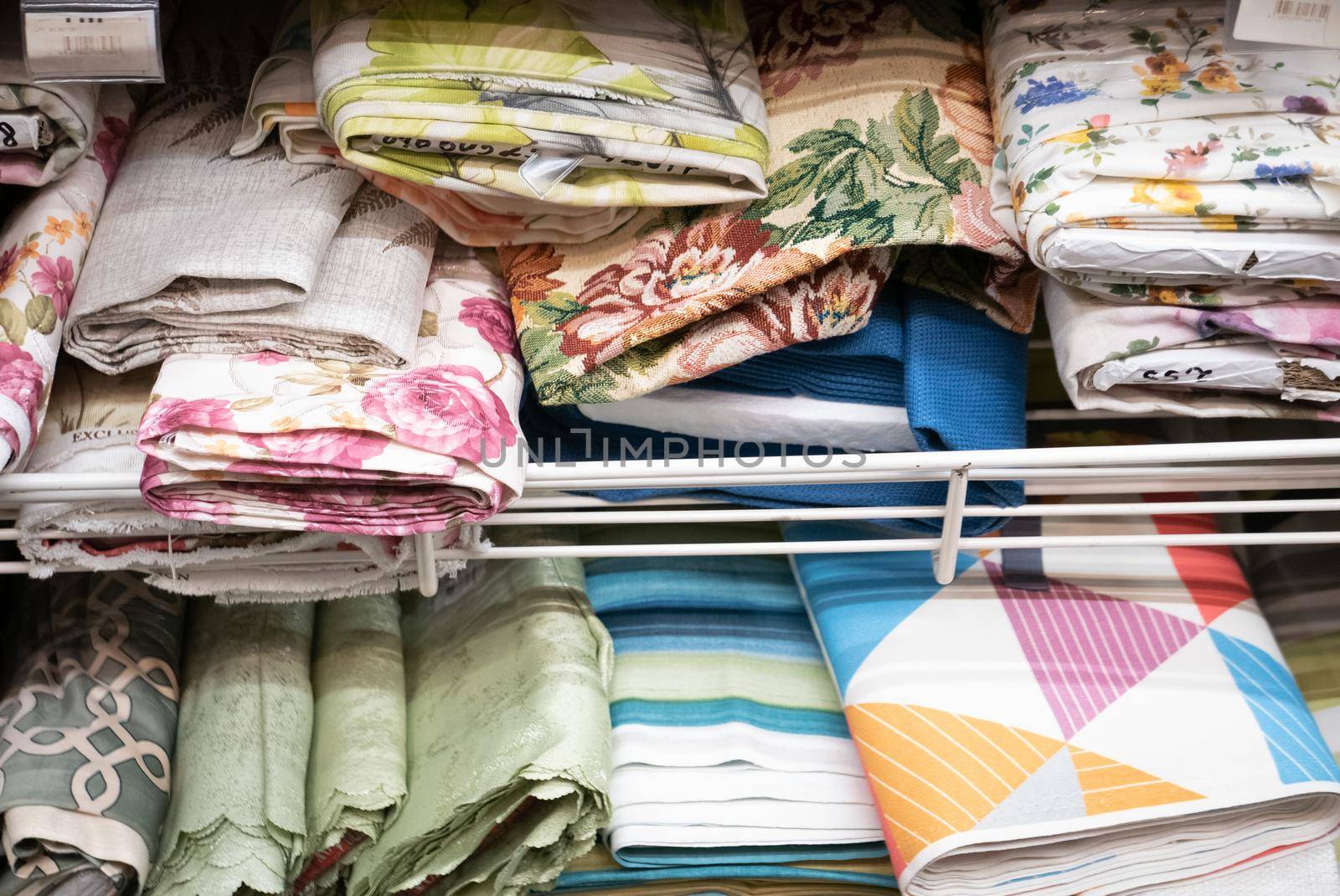 Rolls of fabric material in a textile shop.