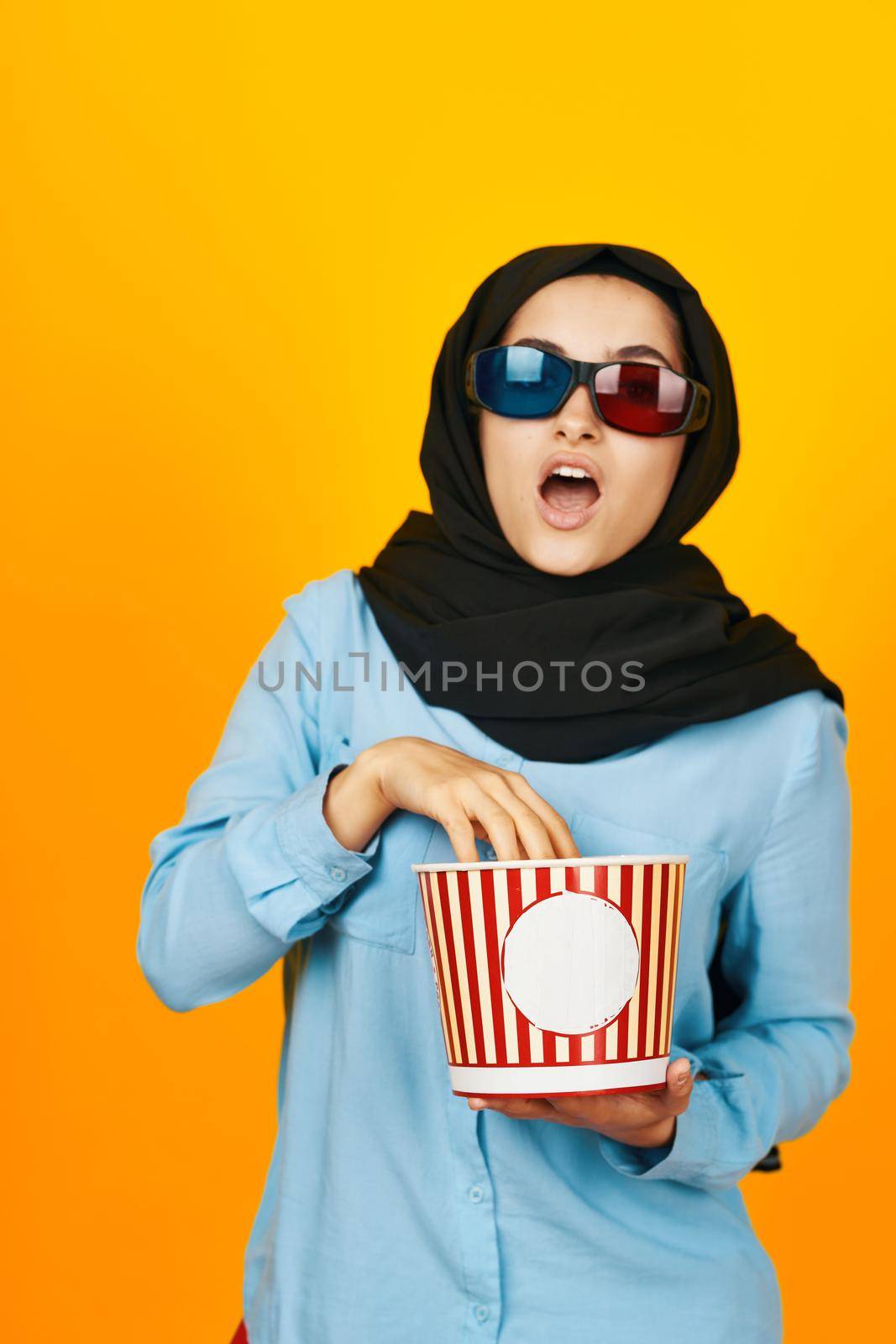 pretty woman 3D glasses watching movies in the cinema yellow background by Vichizh