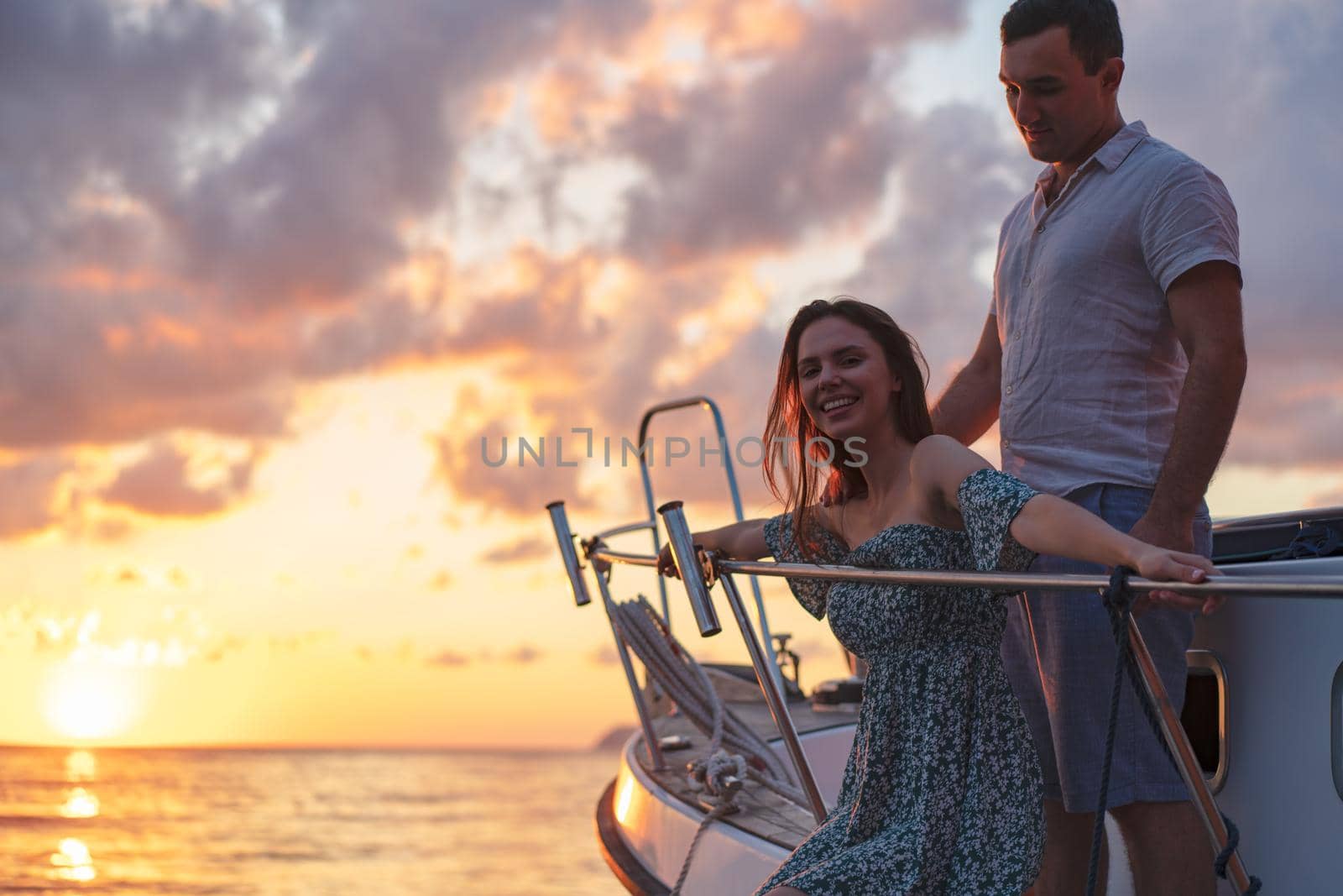 Loving couple spending time on a yacht at the open sea