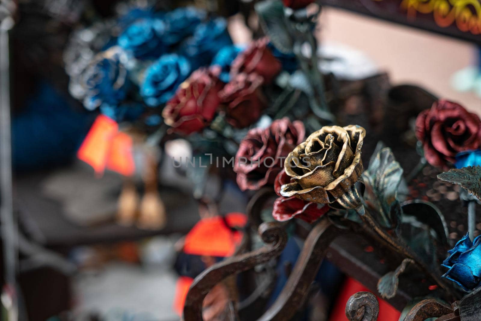 Colored metal roses on the street market