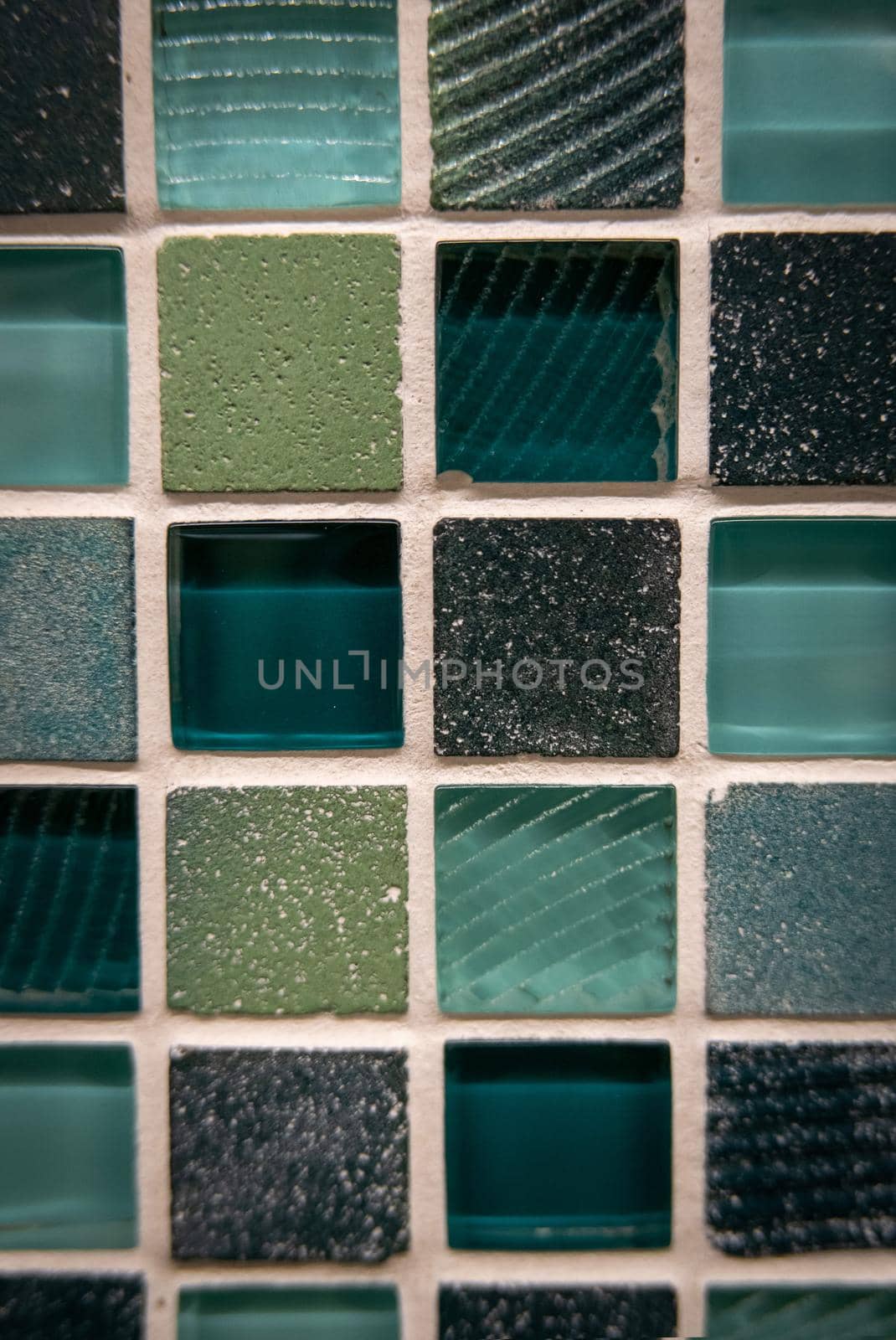 Green ceramic mosaic on the wall as background