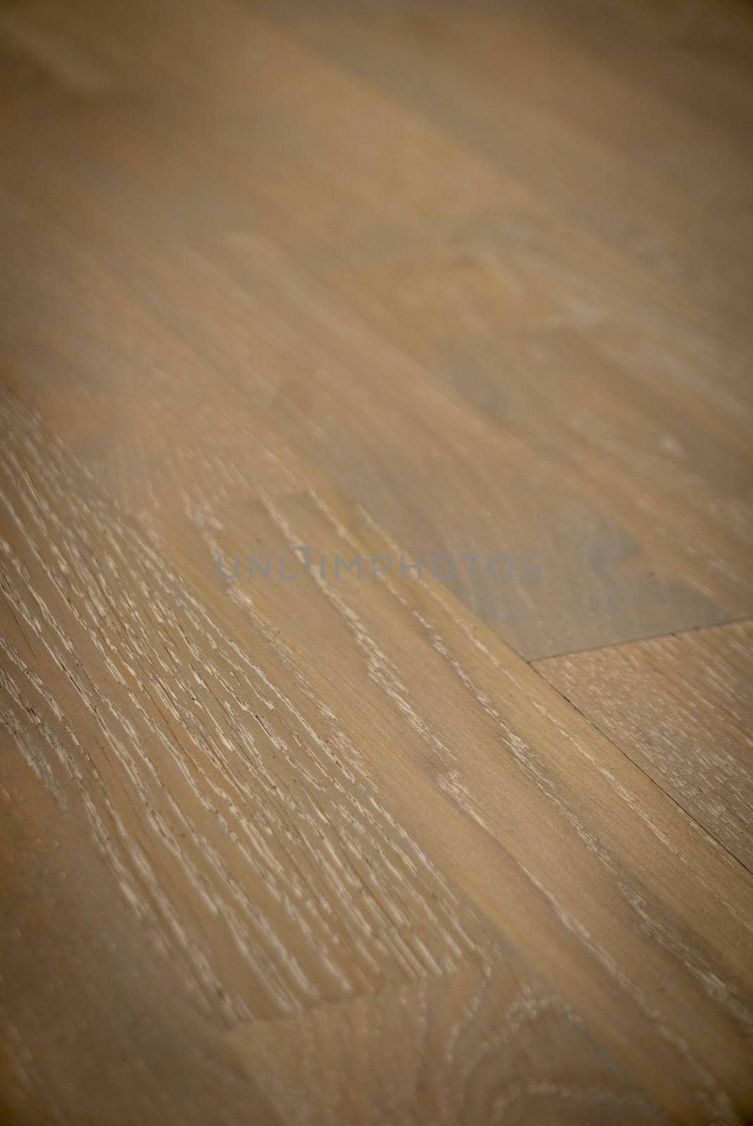 Dark brown wooden parquet floor texture as background.