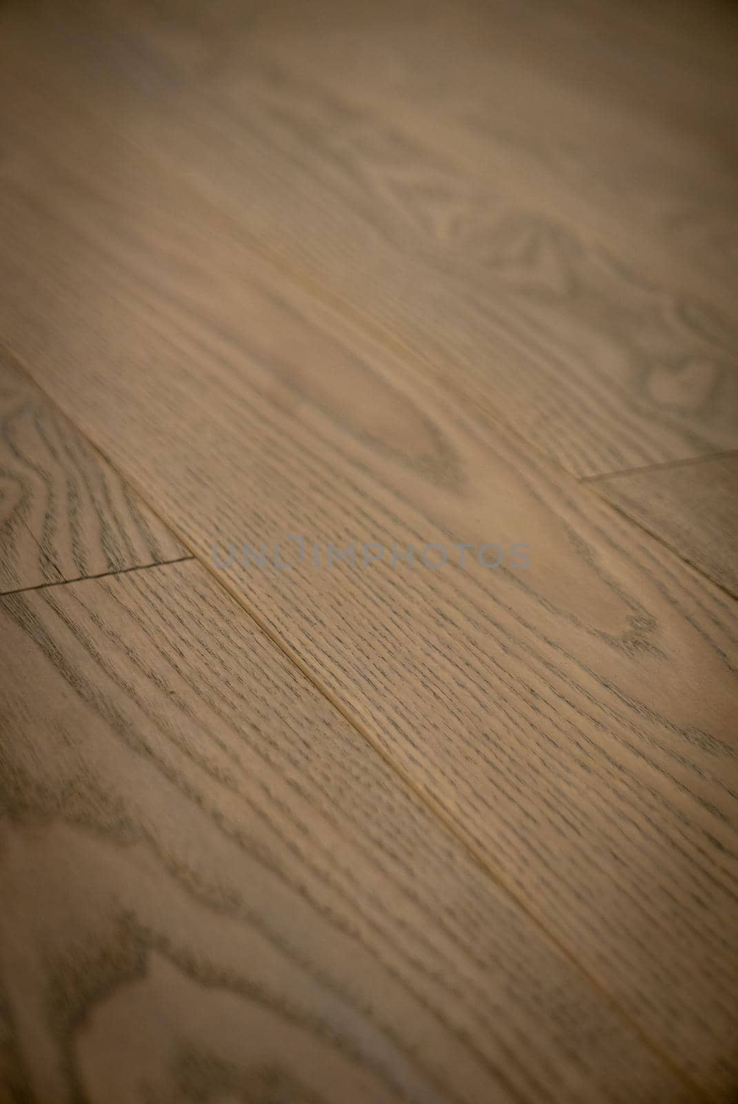 Dark brown wooden parquet floor texture as background.