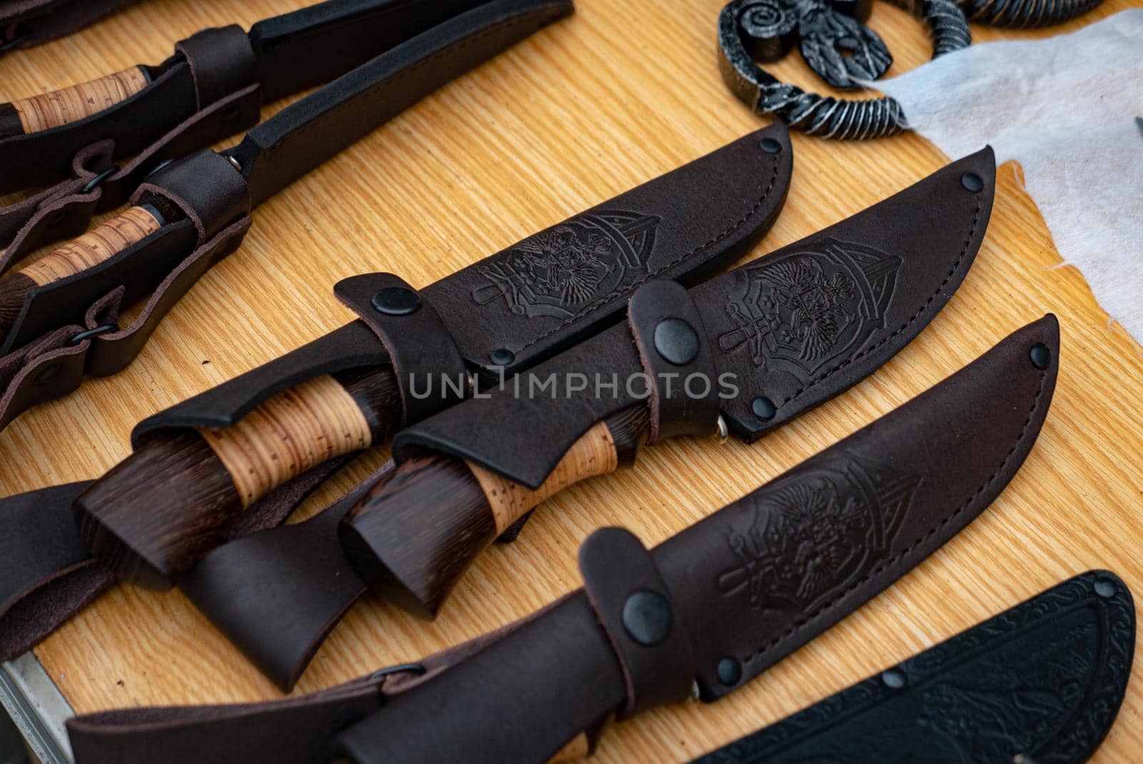 Ryazan, Russia - July 27, 2019: Knives in a leather case on a blacksmith festival