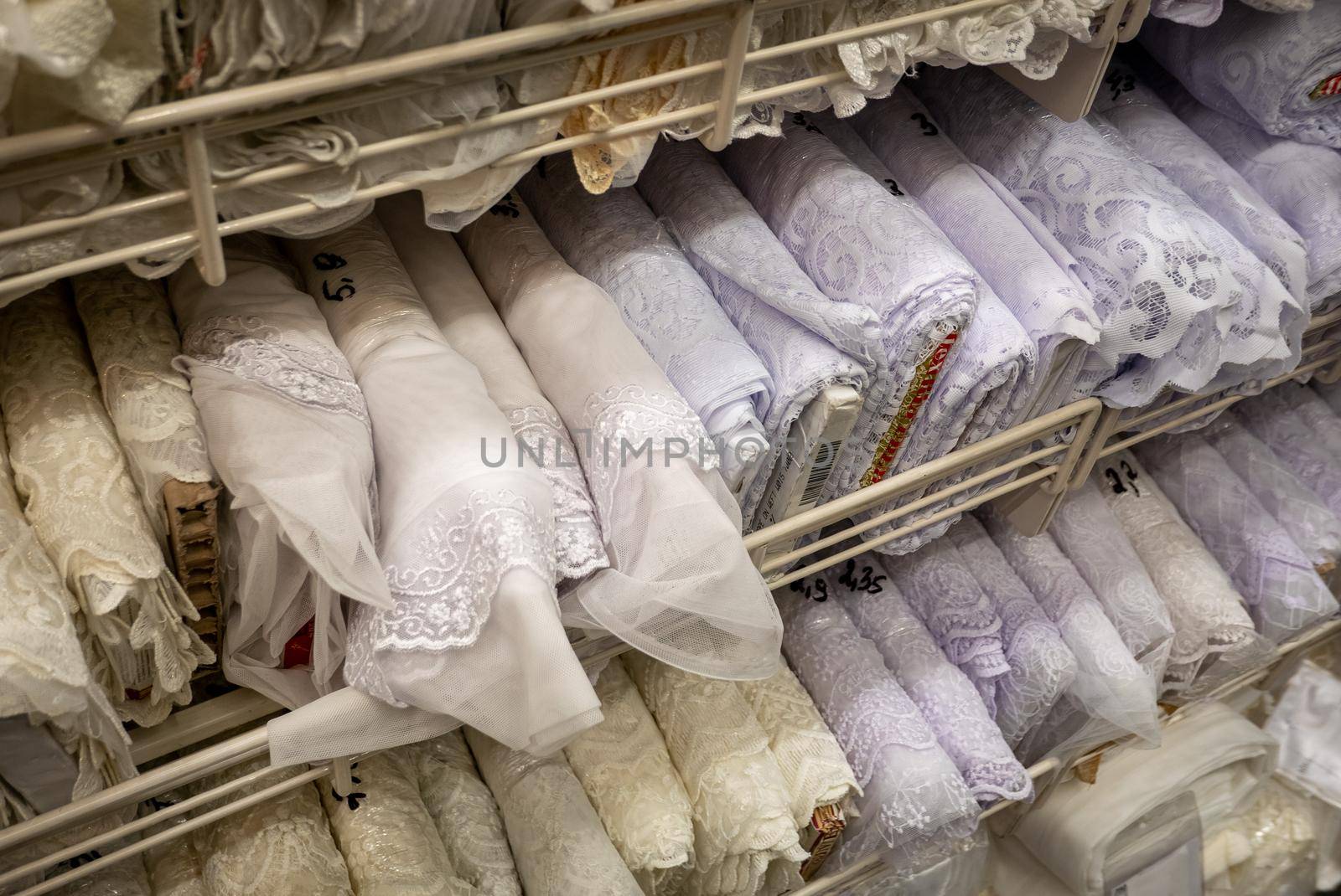 Rolls of fabric material in a textile shop.