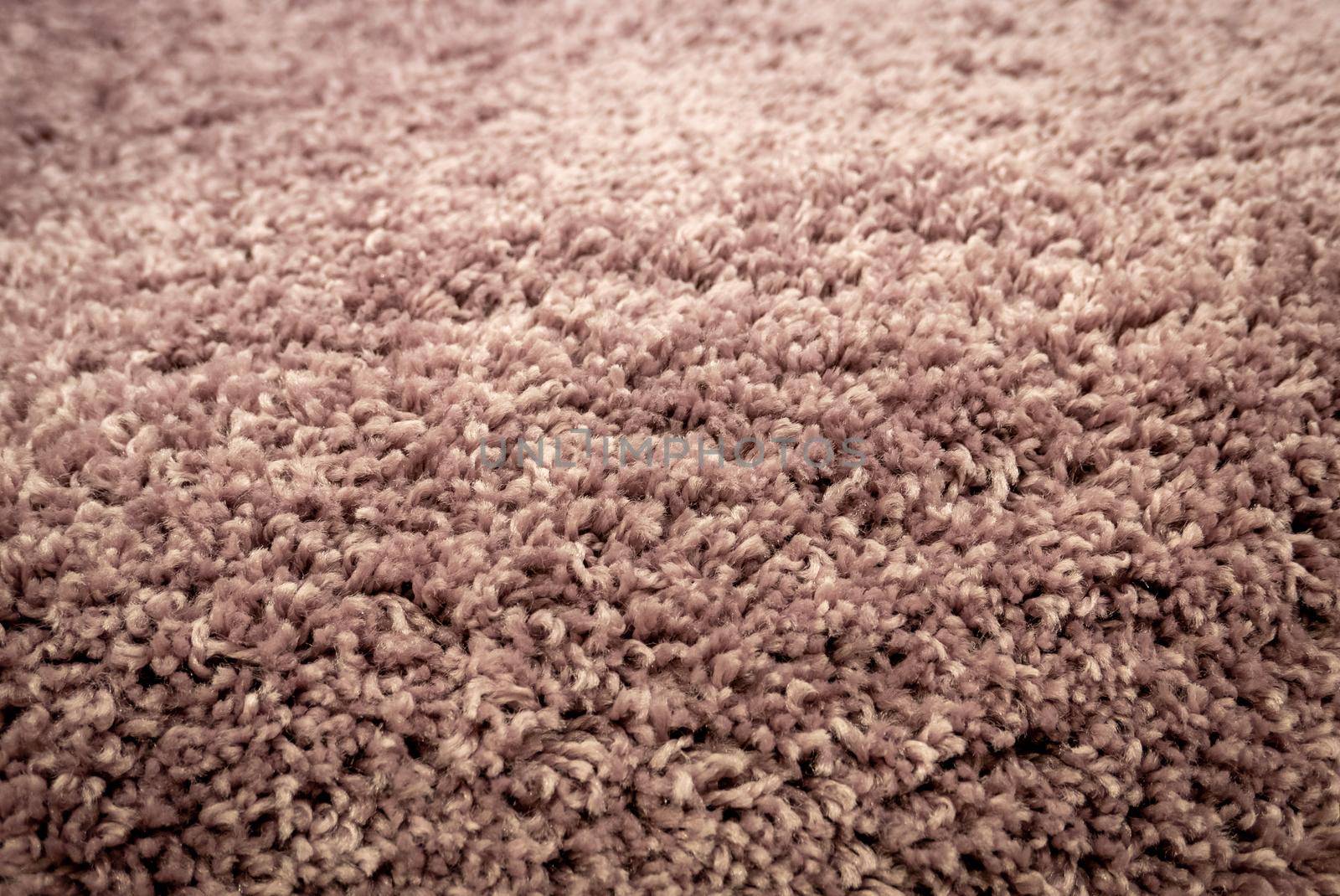 Close up view of carpet. Wall-to-wall carpeting background
