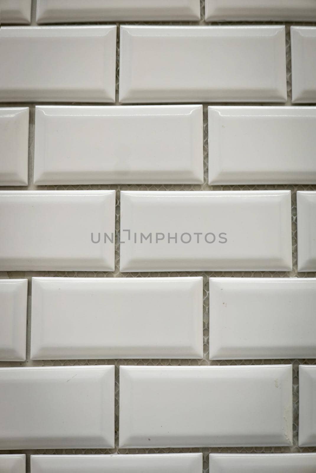 White ceramic bricks on the wall as background.