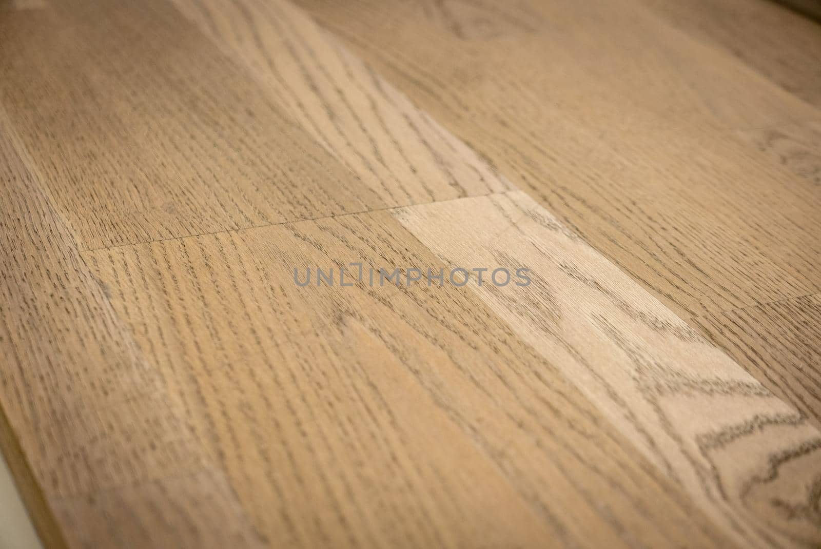 Dark brown wooden parquet floor texture as background.