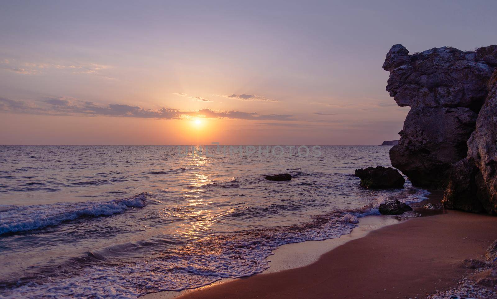 Sea coastline at sunset. by alexAleksei