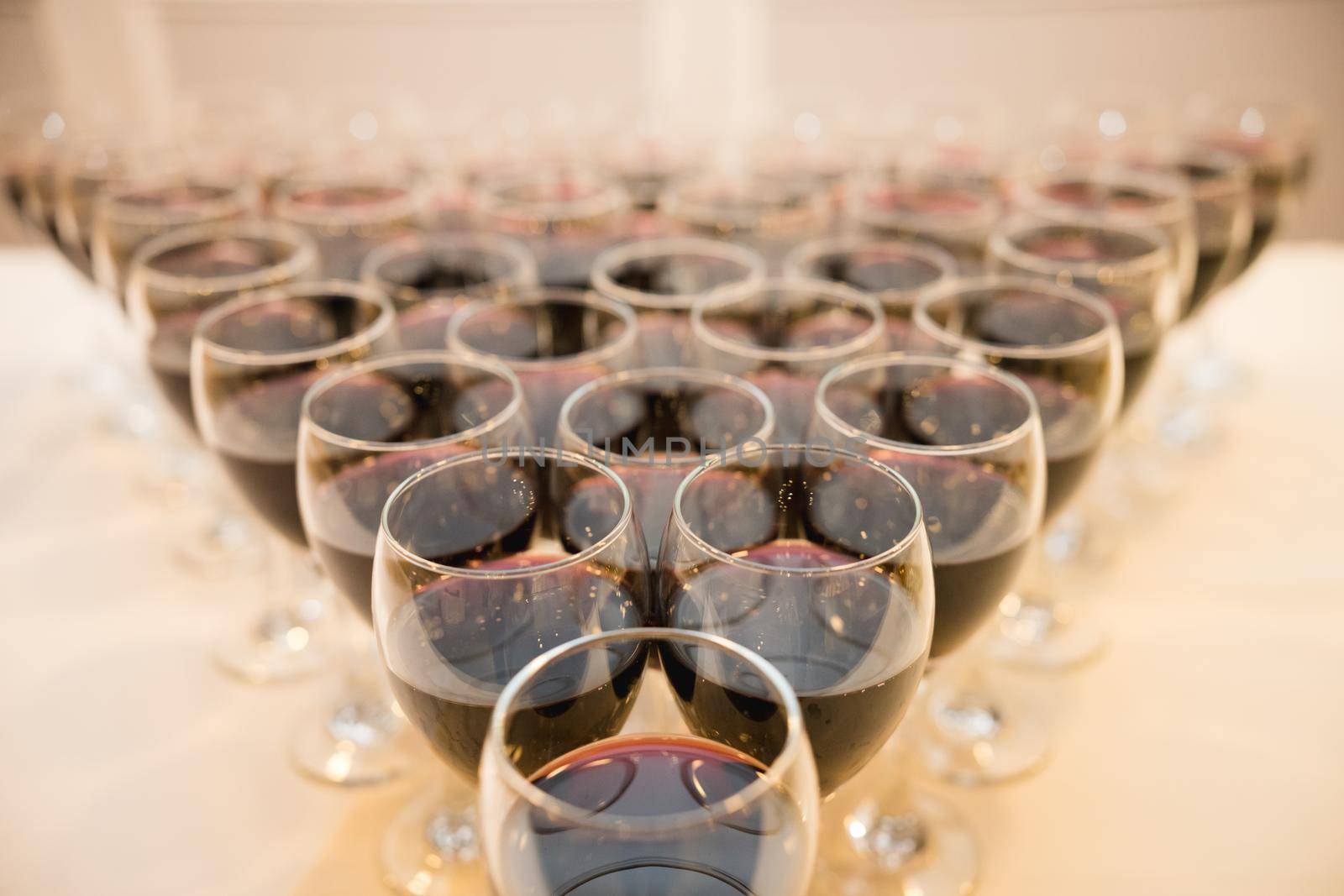 Glasses with alcohol, wine and different drinks on the table