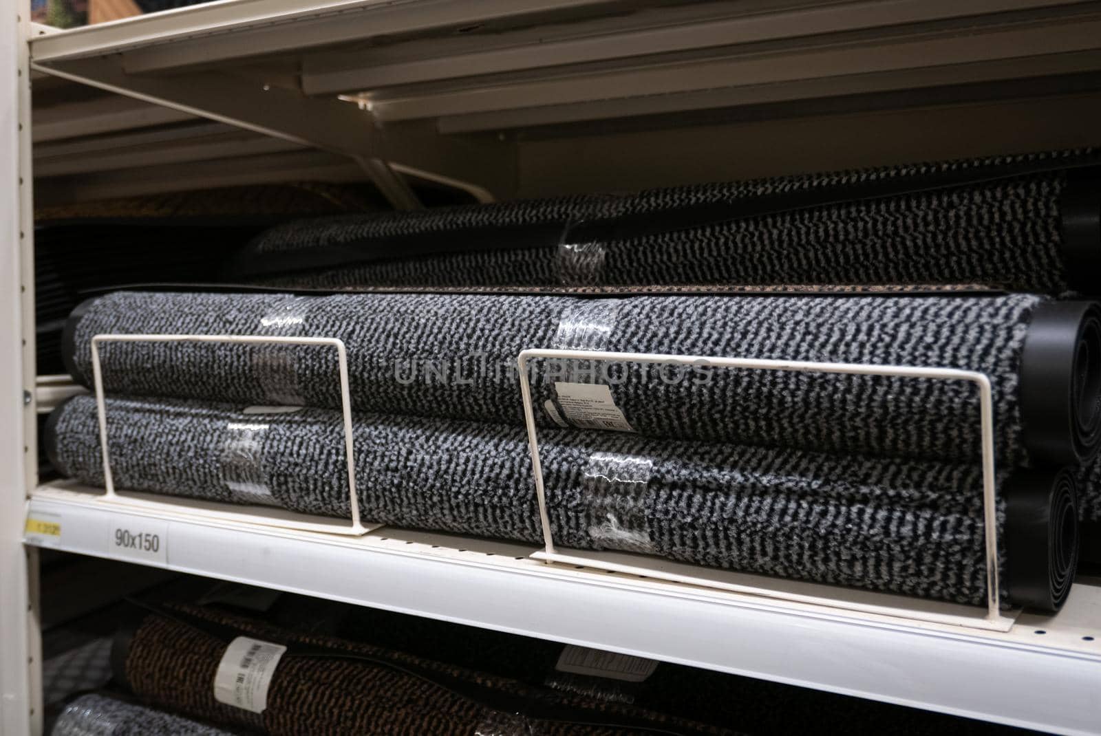 Rolls of doormats in a fabric shop.