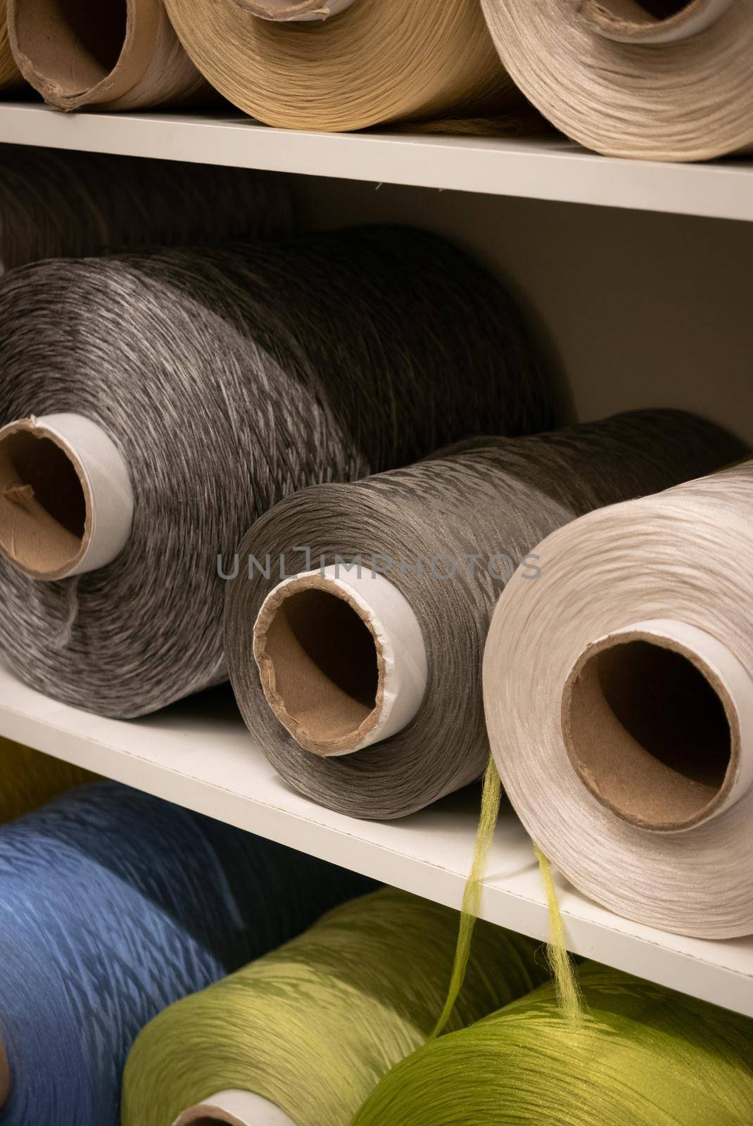 Cotton sewing threaded reels in a sewing shop.