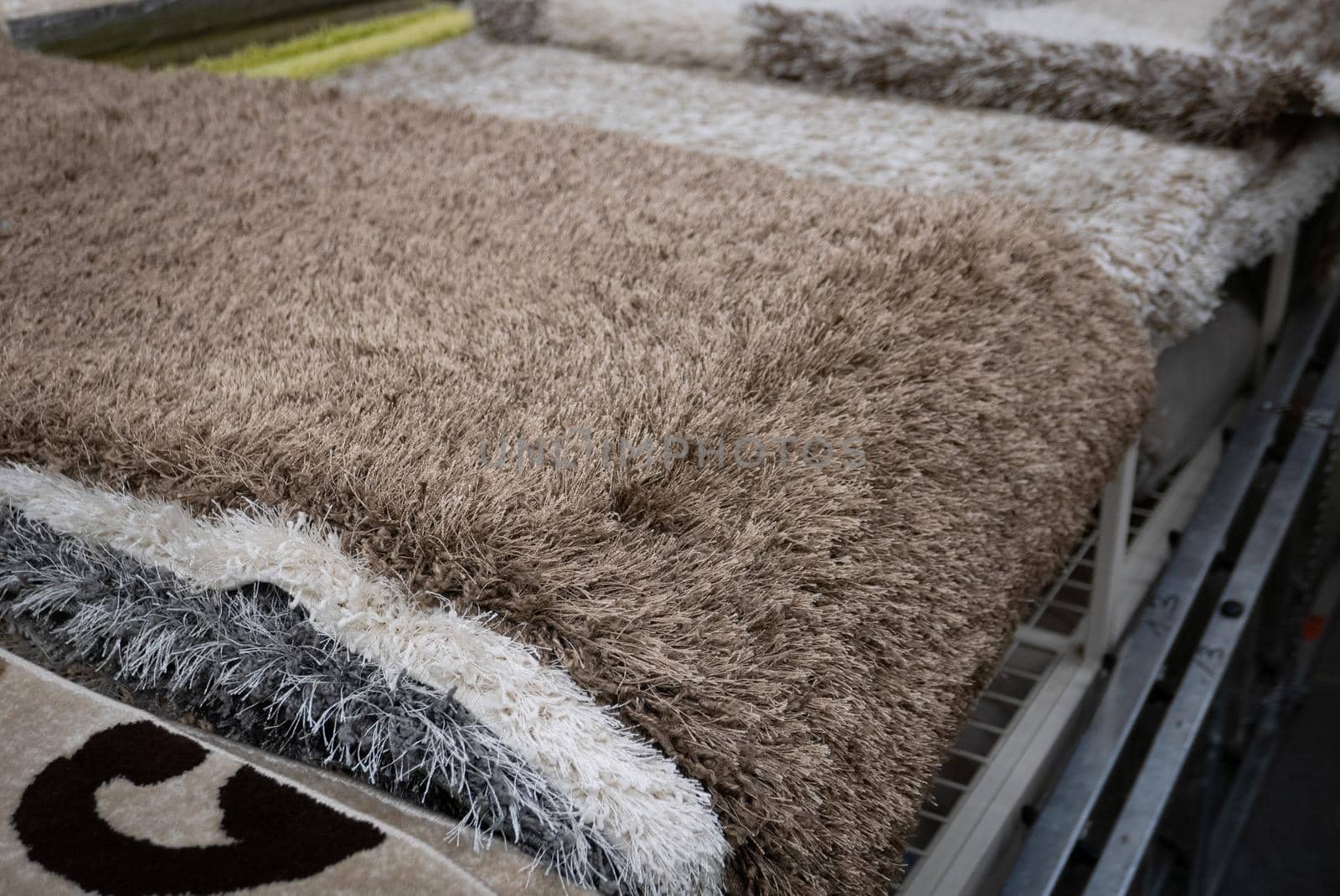 Pile of carpets in a home decoration shop.