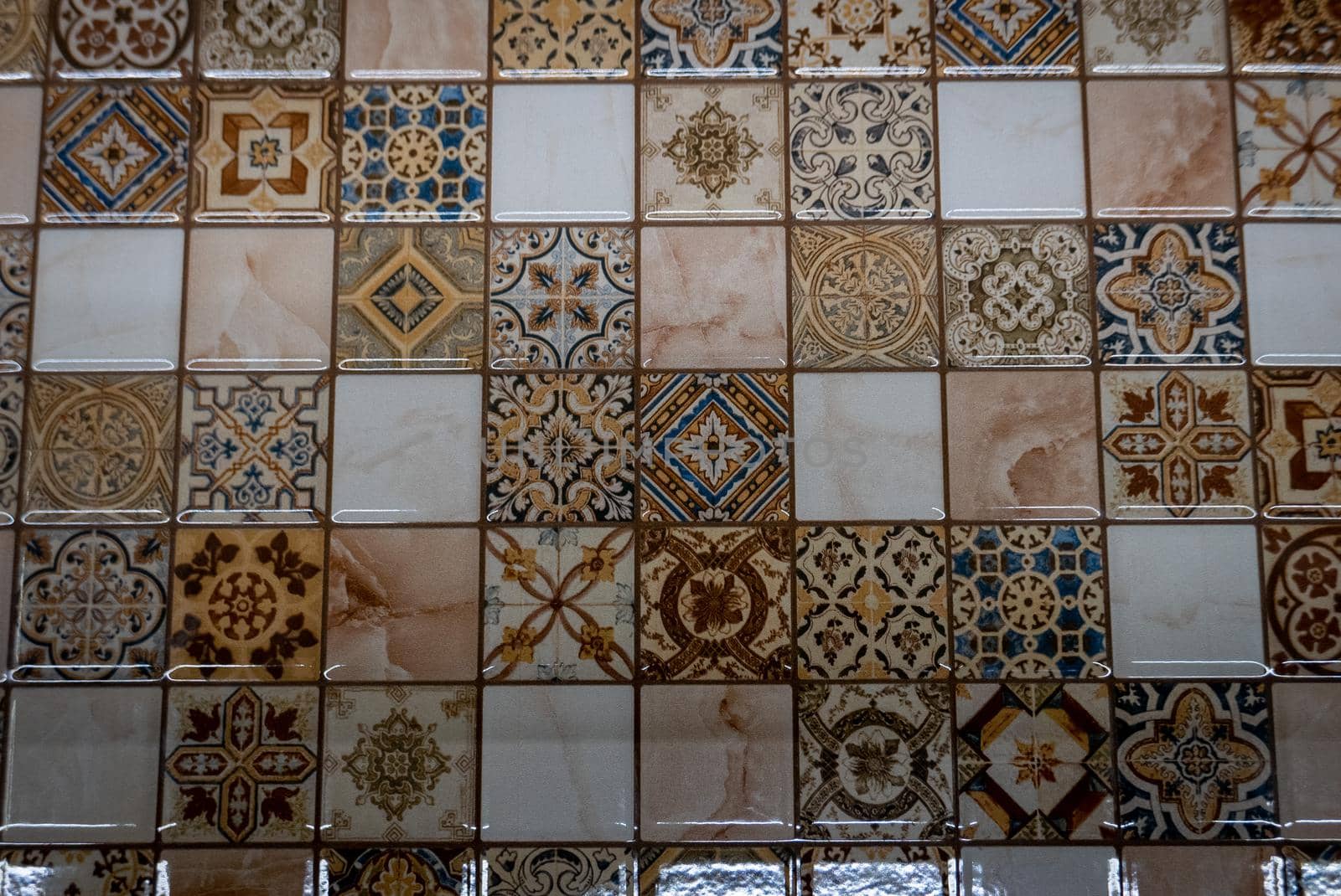 Small tiles of ceramic mosaic on the wall.