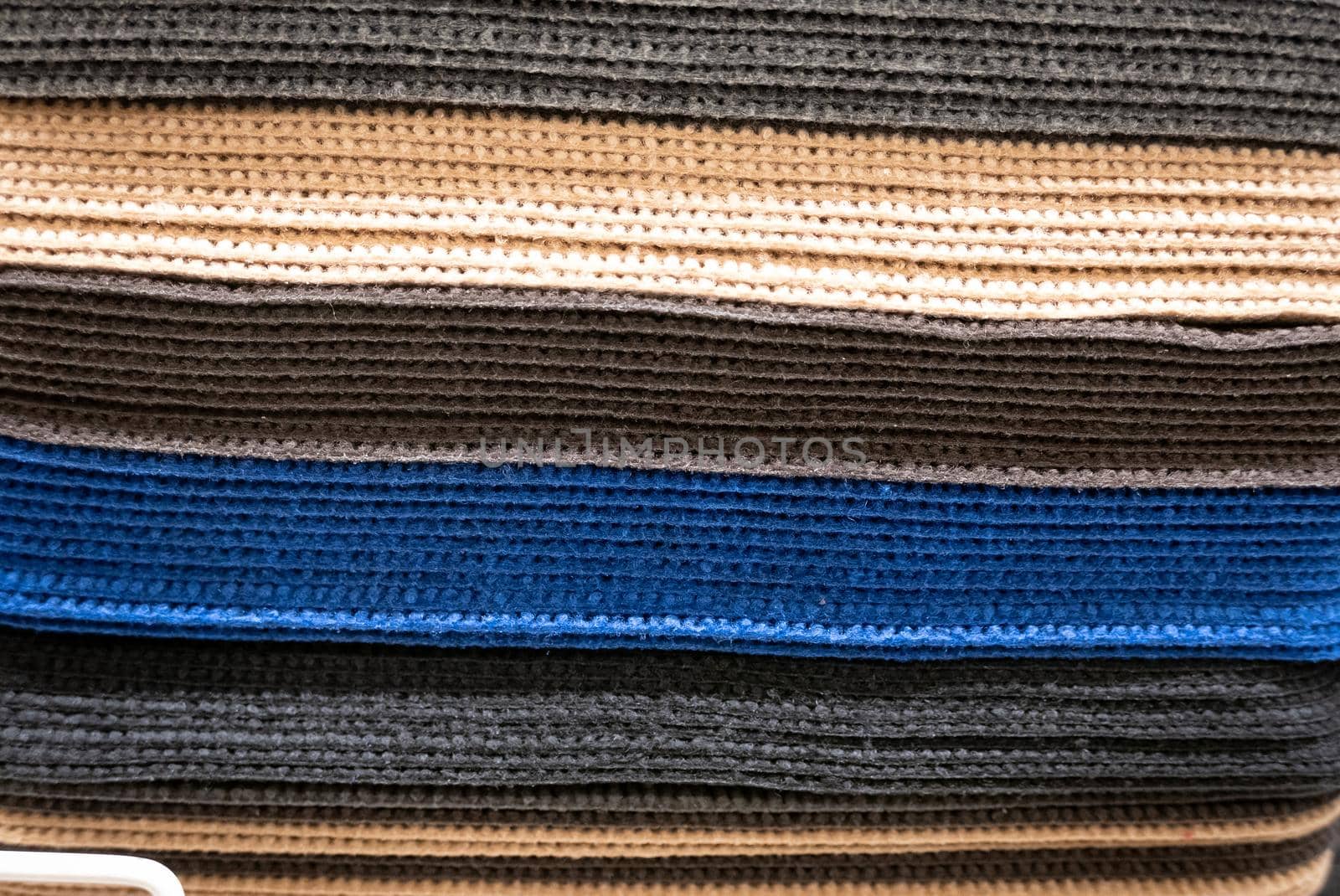 Pile of car mats in a fabric shop.