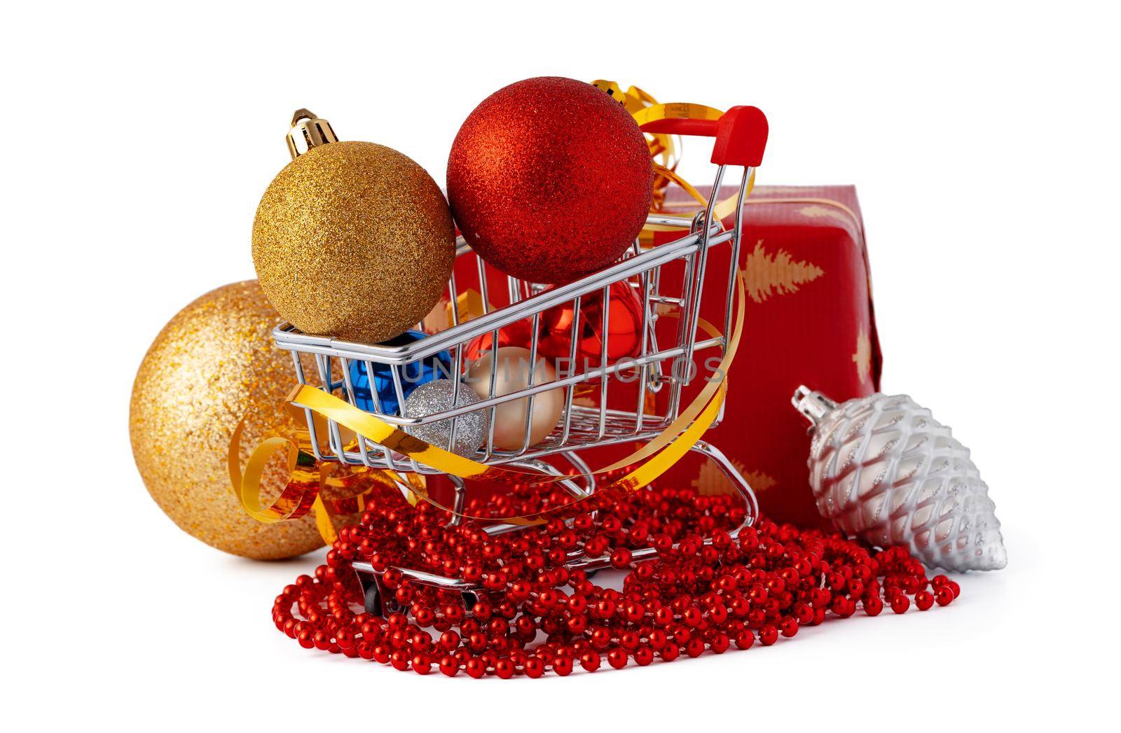 Shopping cart with Christmas decorations isolated on white background, close up