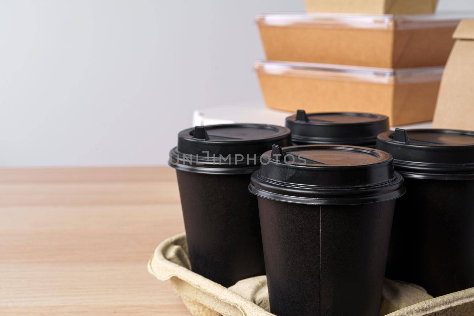 Many various take-out food containers, pizza box, coffee cups and paper bags on light grey background. Food delivery