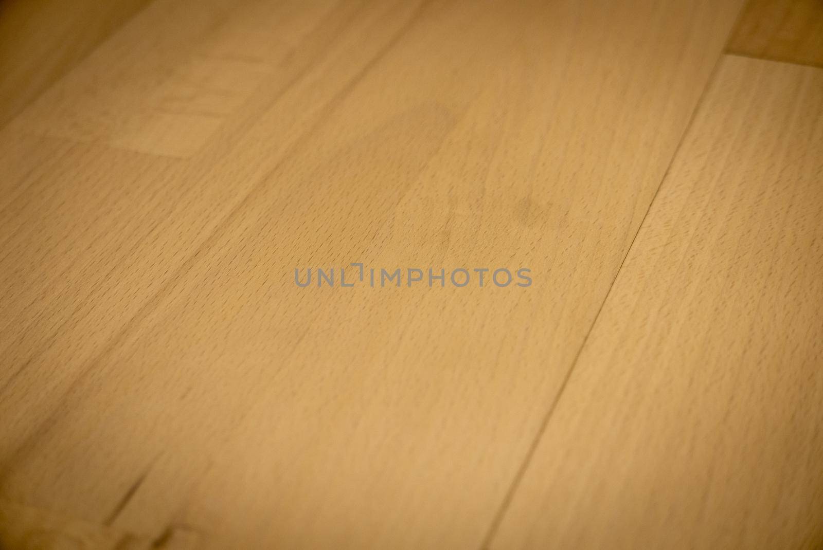 Yellow or light brown parquet texture as a background.