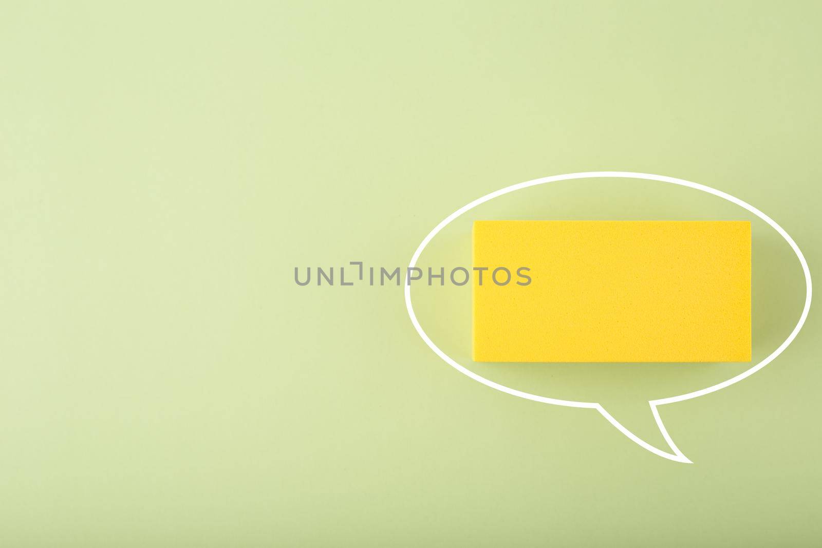 White speech bubble with space for text on bright green background with copy space by Senorina_Irina