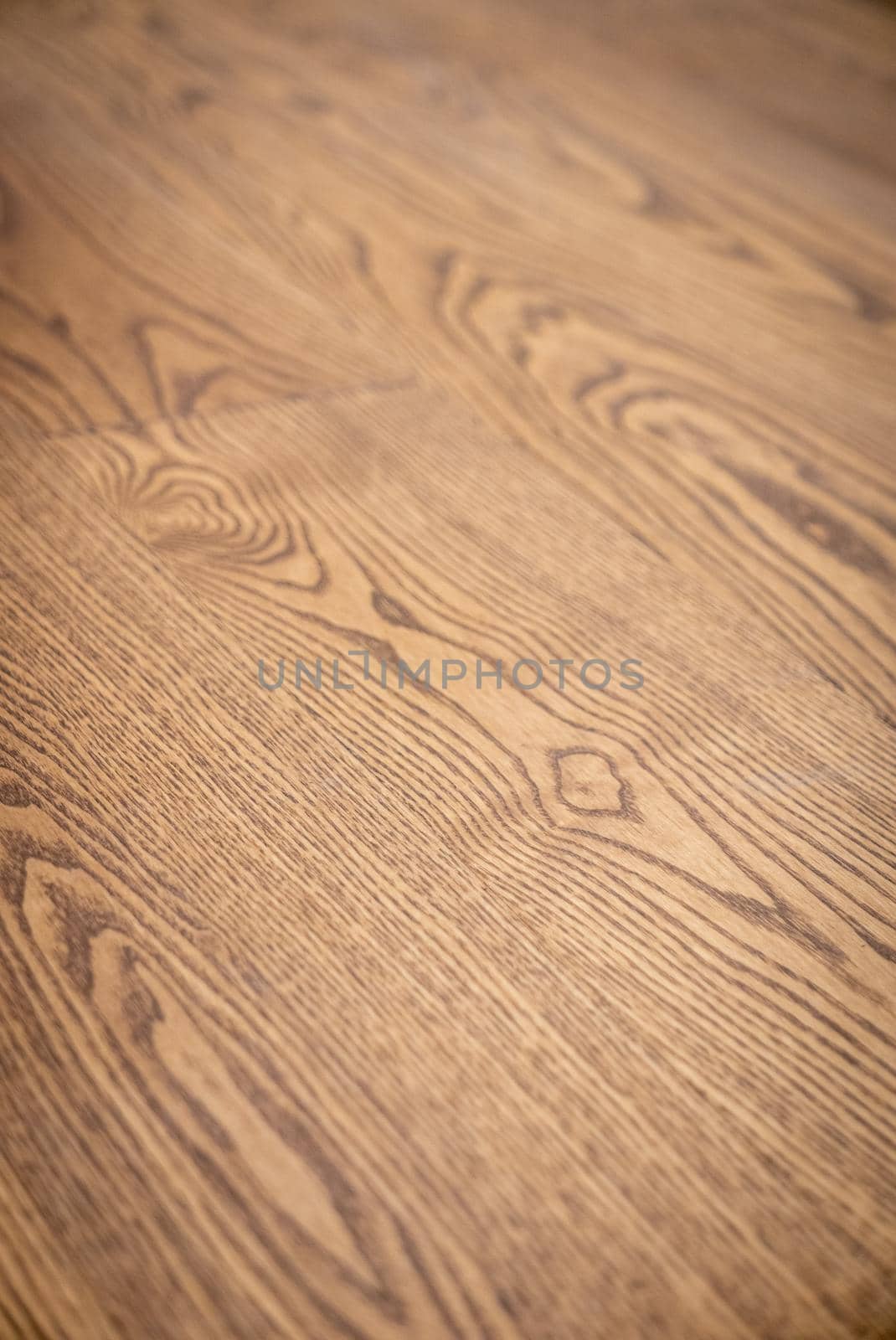 Dark brown wooden parquet floor texture as background.