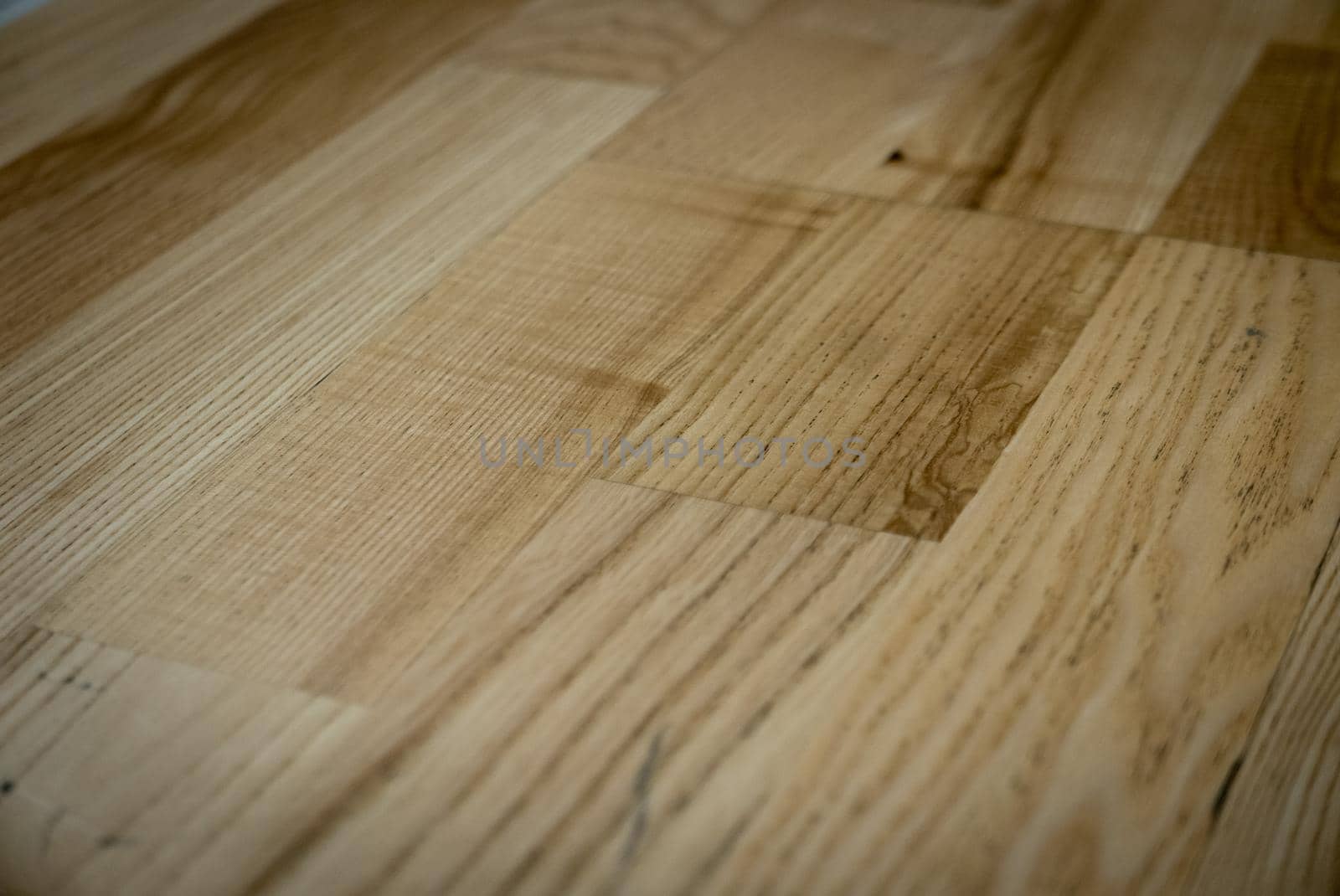 Dark brown wooden parquet floor texture as background.
