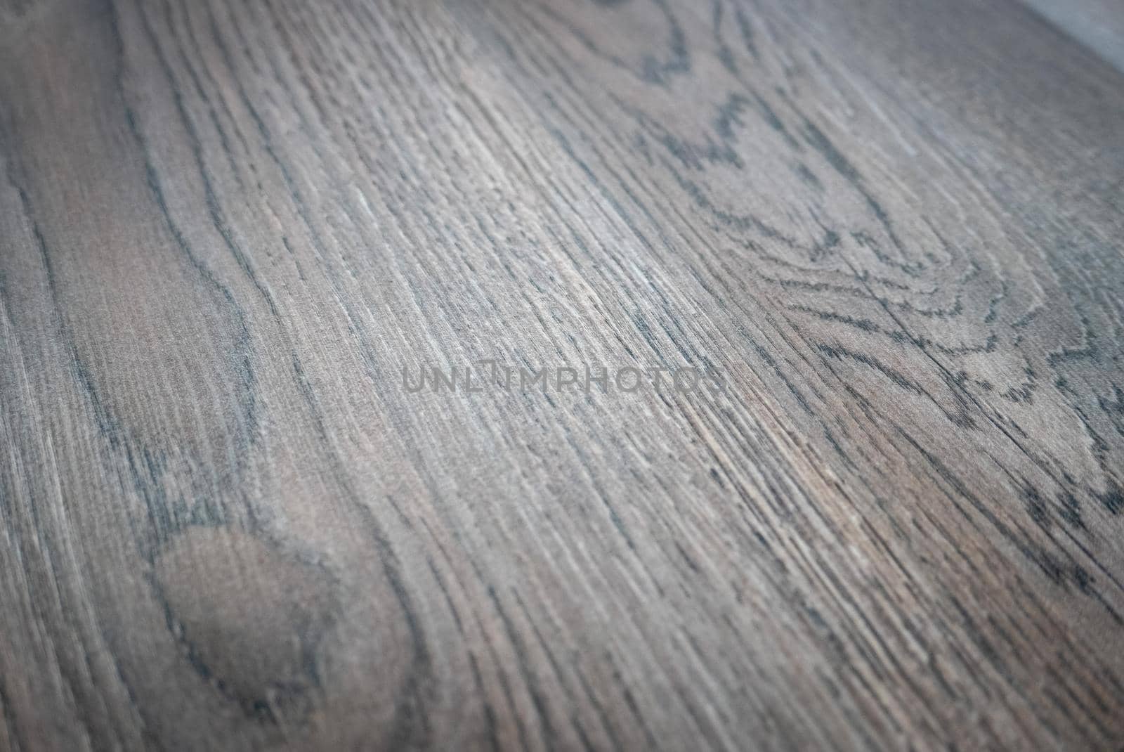 Dark brown wooden parquet floor texture as background.