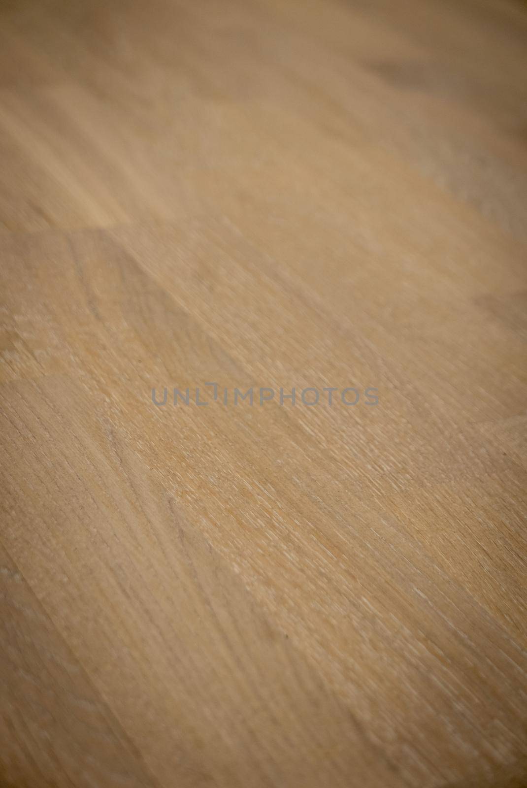 Dark brown wooden parquet floor texture as background.