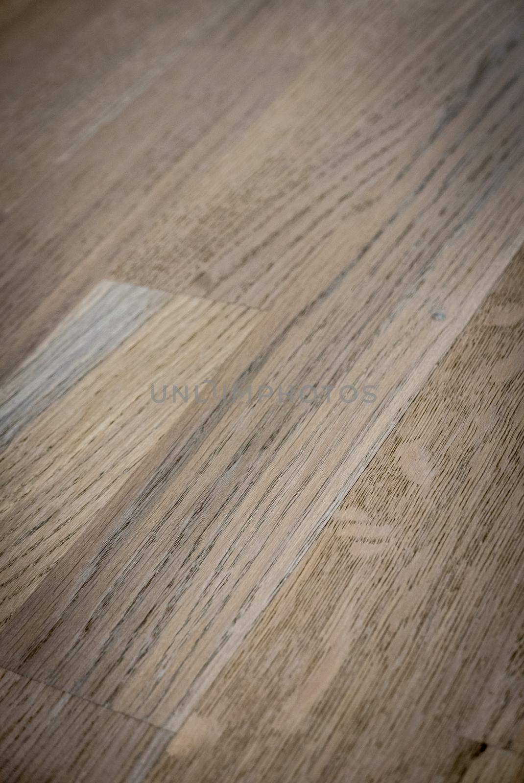 Dark brown wooden parquet floor texture as background.