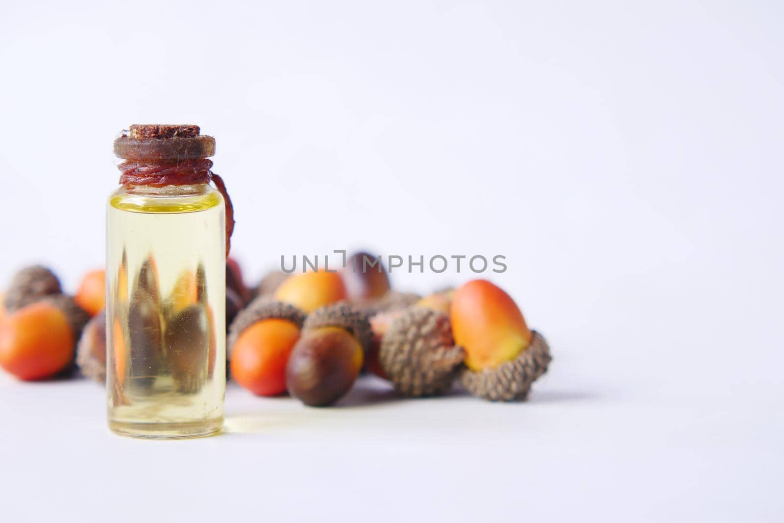 Acorn essential oil isolated on white background